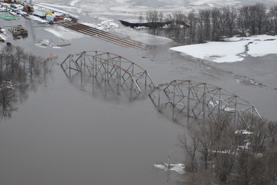 FARGO, N.D. -- A bridge on the Red River, north of Fargo, N.D., sits under water due to the recent flooding of the river here March 29. Currently, the 54th Helicopter Squadron from Minot AFB has two UH-1N "Huey" crews at Grand Forks AFB, N.D., on alert to provide search and rescue missions in support of flood relief along the Red River. (U.S. Air Force photo by Airman 1st Class Joshua Rosales)