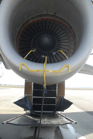 A Charleston AFB C-17 engine being washed with the EcoPower Engine Wash
System on the flightline March. 12. The engine wash system is a closed-loop system that uses only atomized water, collects the effluent water and purifies it for recycled use. (U.S. Air Force Photo/Staff Sgt. Robert Sizelove)  


