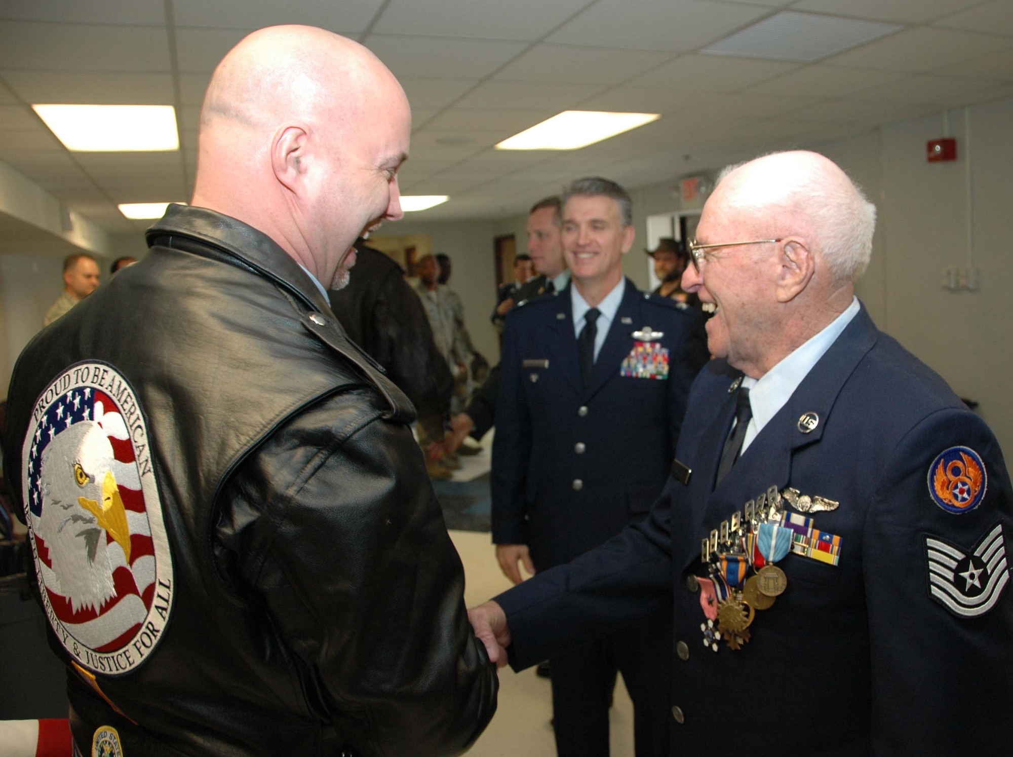 MCGUIRE AIR FORCE BASE, N.J. -- Tech. Sgt., retired, Charles E. Wentzell received several congratulations March 22 at the Timmermann Conference Center on Fort Dix, N.J. The World War II veteran and Ex-POW was formally pinned with seven medals he earned more than 56 years ago during his military service that included duty with the Army, Army Air Corps and the Air Force. (U.S. Air Force photo/Master Sgt. Charles Kramer)
