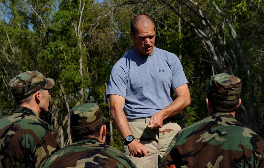 MOODY AIR FORCE BASE, Ga. -- Staff Sgt. Brandon Klein, 66th Training Squadron, Detachment 2, from the Naval Air Station, Pensacola, Fla., survival evasion resistance escape specialist, instructs candidates from class 09A who are enrolled in the combat rescue officer selection course on the proper way to build a fire here March 25. (U.S. Air Force photo by Senior Airman Gina Chiaverotti) 