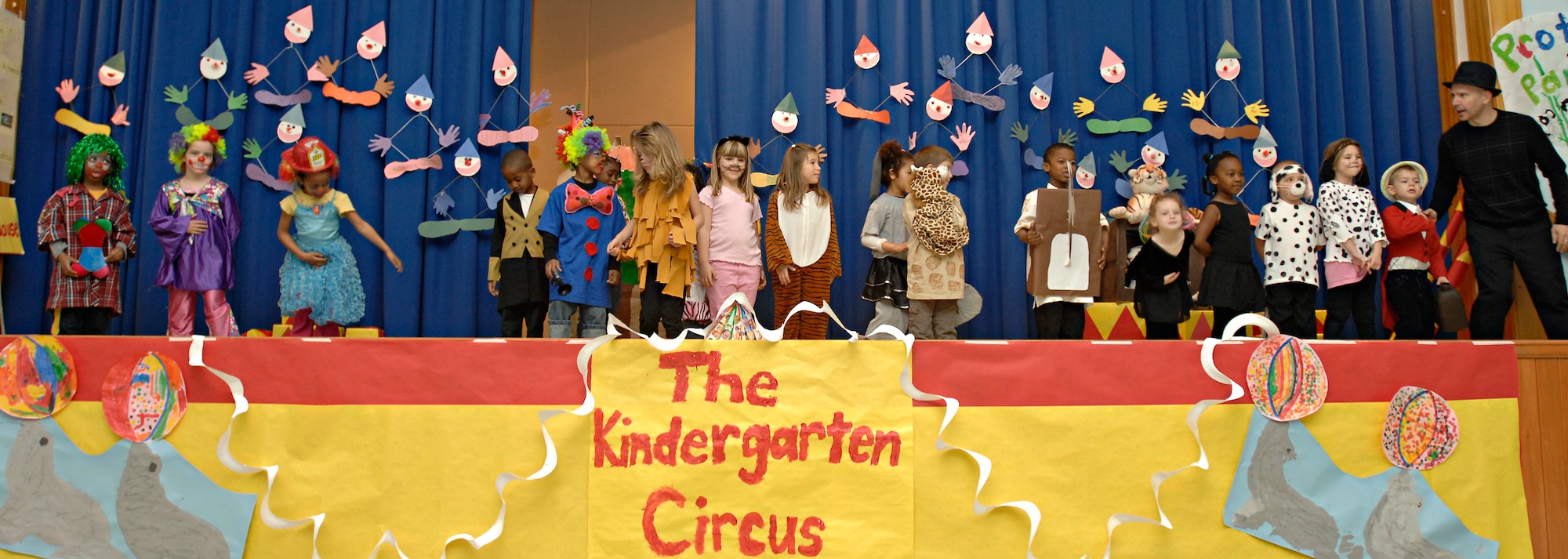 The Incirlik Unit School kindergarten class lines up to take a bow after completing their first-ever circus performance, Friday, March 27, 2009. The children helped design the set, props and costumes, as well as writing the script for the circus they put on for their parents. The whole experience incorporated learning about animals along with math and writing, said Mr. Atkinson. (U.S. Air Force photo/Senior Airman Benjamin Wilson, 39th Air Base Wing Public Affairs)