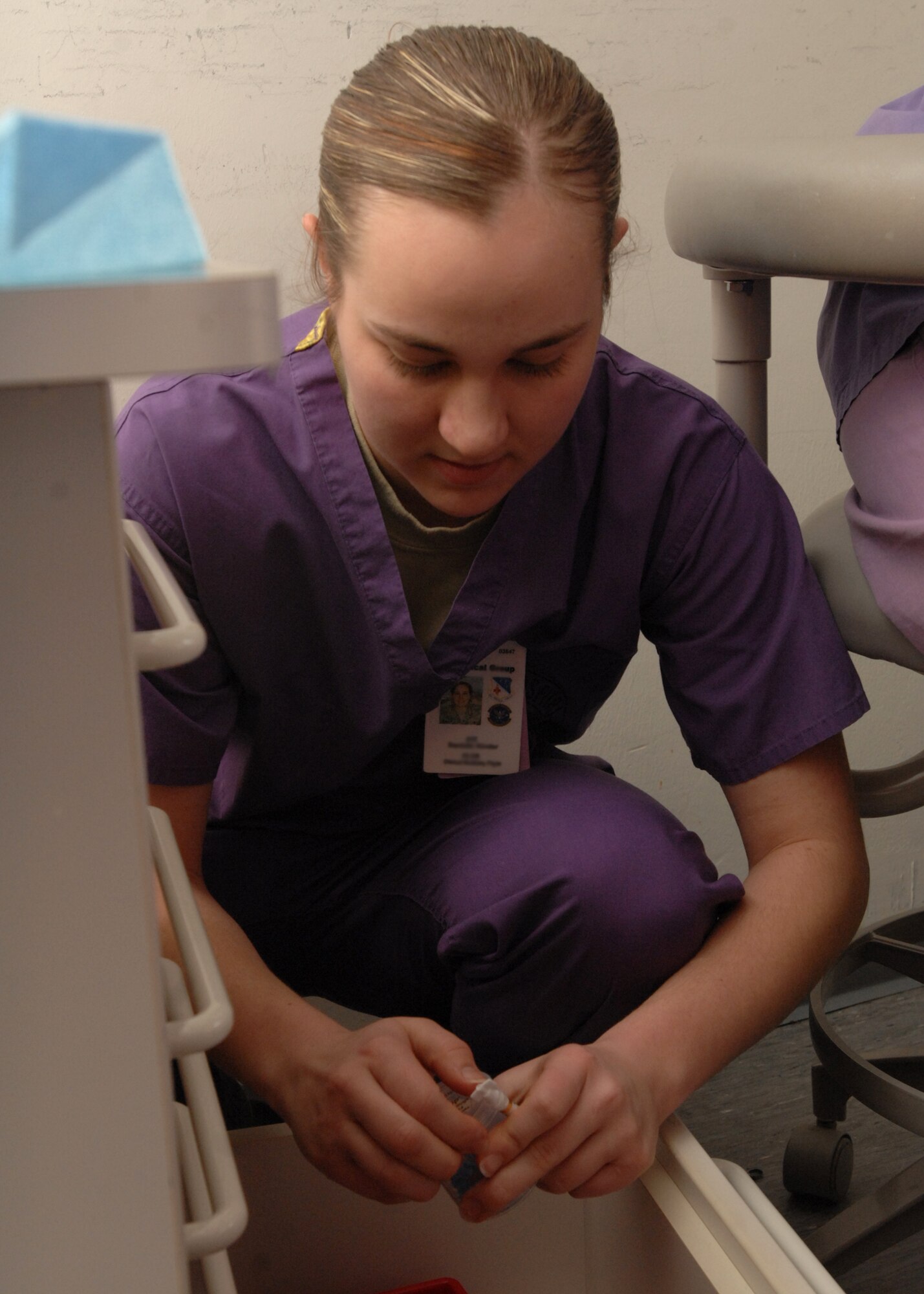 SPANGDAHLEM AIR BASE, Germany -- Airman 1st Class Danielle Kinder, 52nd Dental Squadron, looks for the correct dental tool March 27, 2009. Airman Kinder has been in the Air Force for one year. Airman Kinder is the 52nd Fighter Wing's Top Saber Performer for the week of April 3-9. (U.S. Air Force photo by Senior Airman Jenifer H. Calhoun)