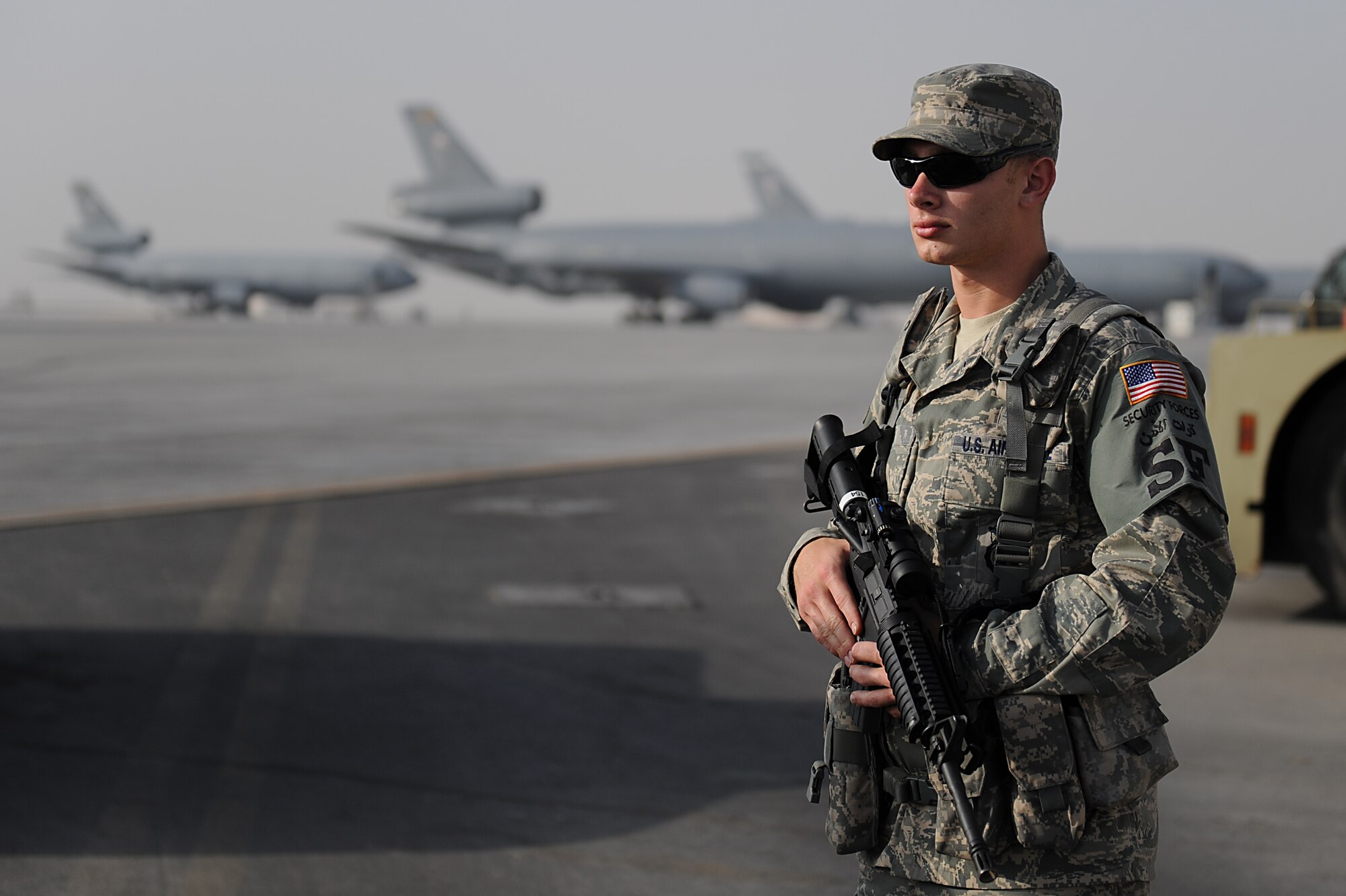 SOUTHWEST ASIA - Airman 1st Class Nicholas Krom, 380th Expeditionary Security Forces Squadron, response force member stands at his post on the flightline, Mar 21. Airman Krom's post is responsible for keeping any unauthorized people from entering the flightline keeping the area safe for other Airman to complete their mission.  Airman Krom is deployed from the 48th Security Forces Squadron, RAF Lakenheath, England and hails from Bristol, Conn. (U.S. Air Force photo by Senior Airman Brian J. Ellis) (Released)