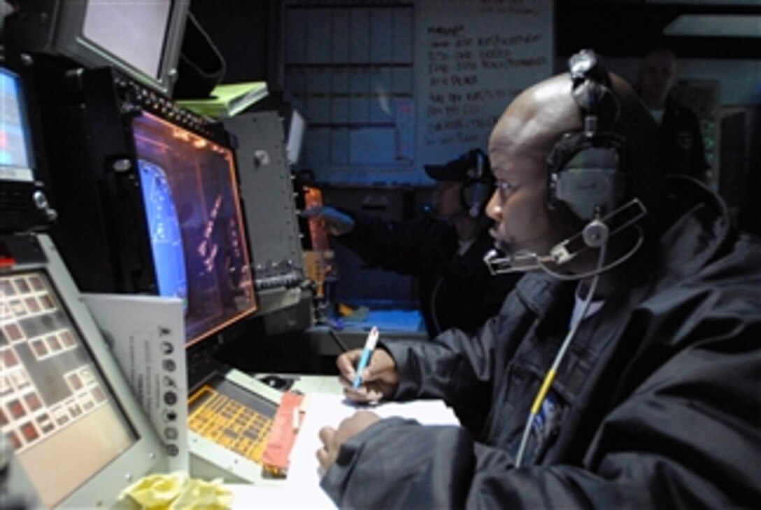 U.S. Navy Petty Officer 2nd Class Carlos Warren logs the Identification Friend or Foe status of an aircraft while standing strike watch aboard the aircraft carrier USS Ronald Reagan (CVN 76) in the Pacific Ocean on March 19, 2009. The Identification Friend or Foe system identifies all aircraft leaving and returning to the ship.  The Ronald Reagan and Carrier Air Wing 14 are underway conducting a sustainment exercise.  