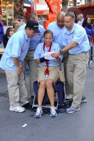 Members of Team Nellis sing "I'm a Little Teacup" in the final segment of the 2009 Corporate Challenge Executive Relay Race held at the Freemont Street Experience March 27.  The 2009 City of Las Vegas Corporate Challenge, sponsored by the Las Vegas Parks and Recreation Department, takes place March 25 to June 13.  (U.S Air Force photo by Staff Sgt. Taylor Worley) 