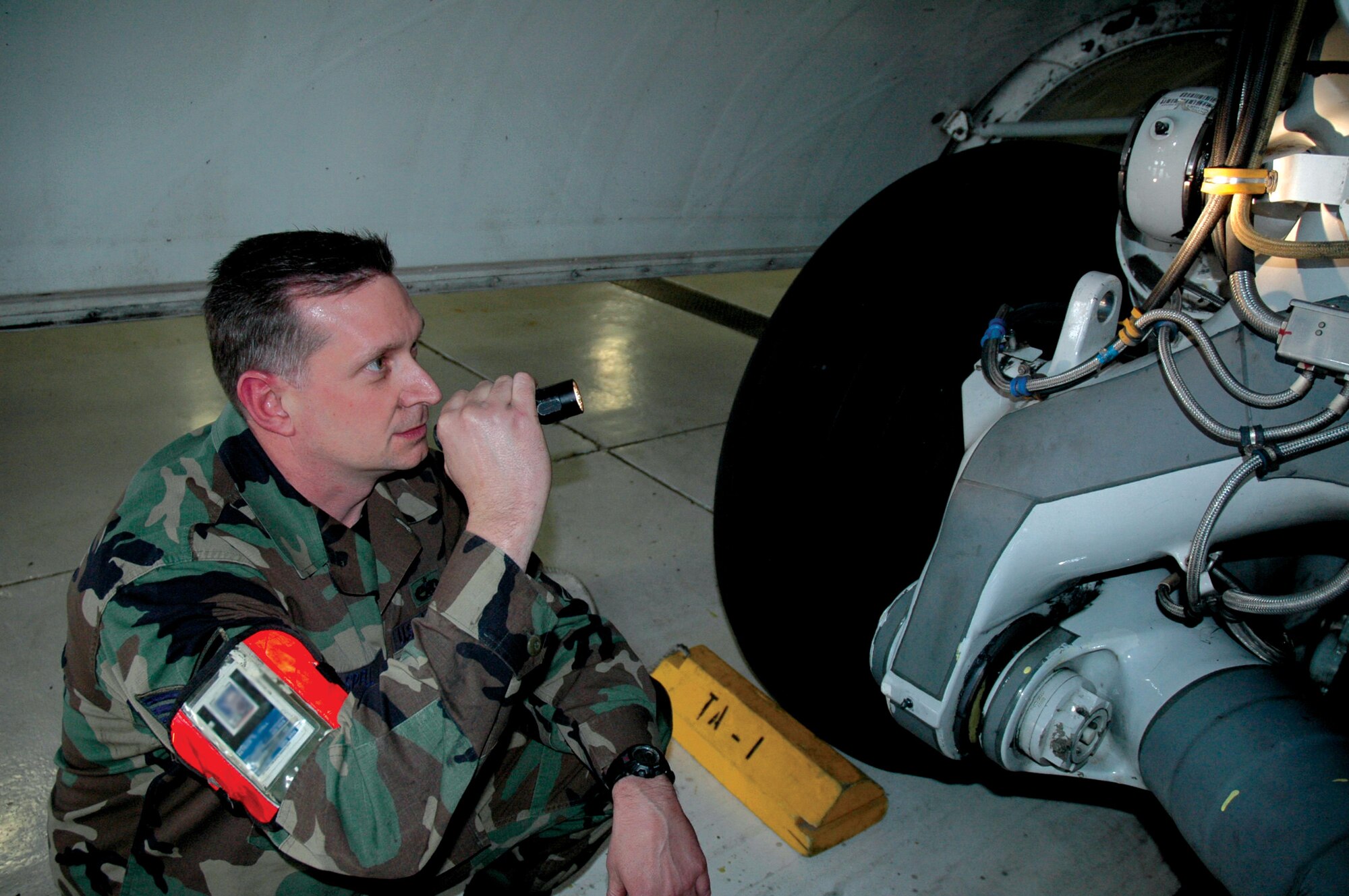 Tech. Sgt. Patrick Spell, 446th Aircraft Maintenance Squadron, inspects a tire on a C-17 Globemaster III March 7 during a Unit Training Assembly. Sergeant Spell has served with the 446th Airlift Wing for six years and has a civilian career with the U.S. Army Corps of Engineers. His favorite thing about being a Reservist: "The diversity of people I run into." (U.S. Air Force photo/Senior Airman Nicole Celestine)