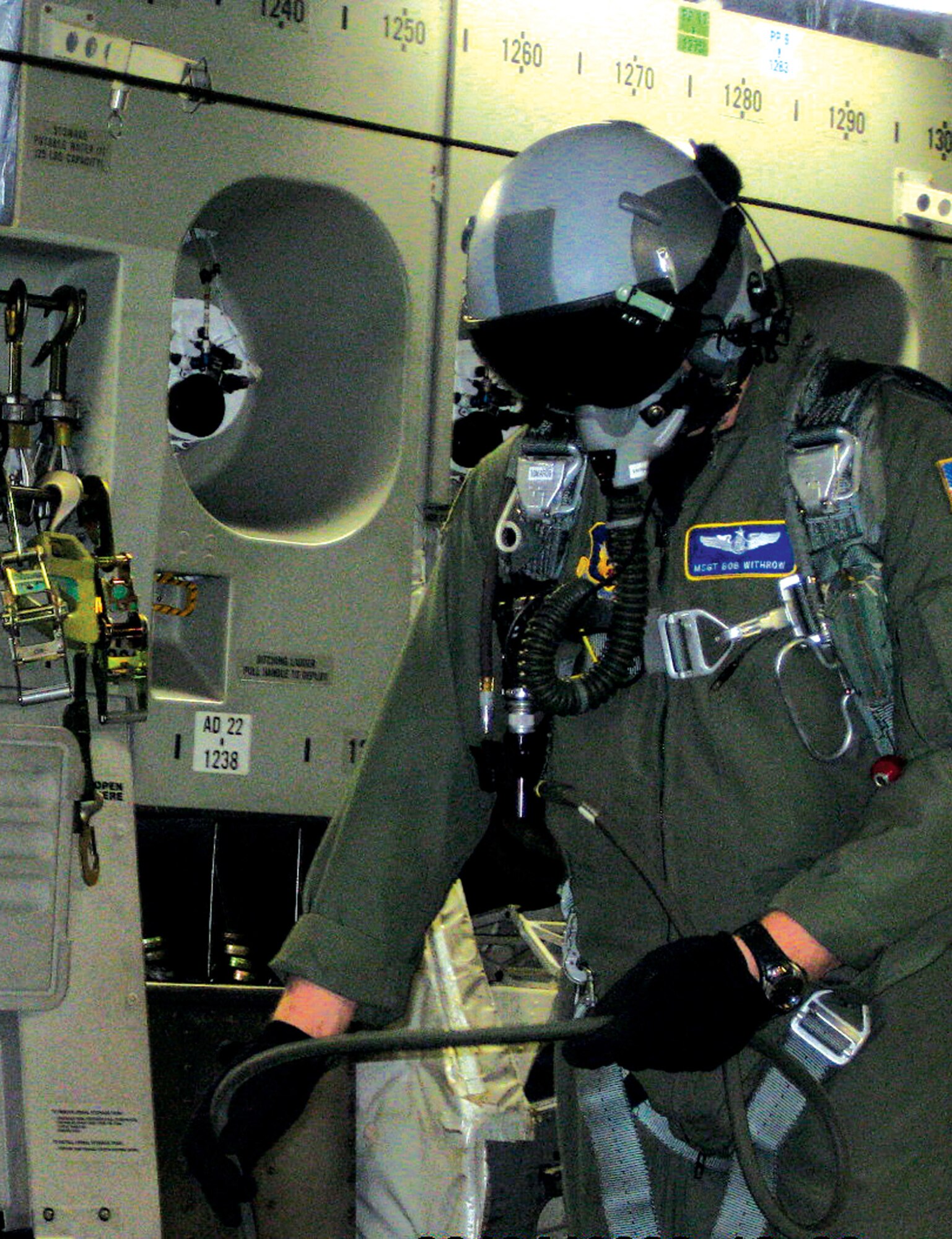Master Sgt. Bob Withrow, 313th Airlift Squadron loadmaster, makes a last minute adjustment to his oxygen as the C-17 carrying soldiers in the Basic Airborne Course, Fort  Benning, Ga., moves up to 14,500 feet for their training jump. Sergeant Withrow, along with nine other Airmen in the Air Force Reserve's 446th Airlift Wing, McChord Air Force Base, Wash., provided critical support to the Army's initial jump training course. (U.S. Air Force photo/Senior Master Sgt. John Vujovich)