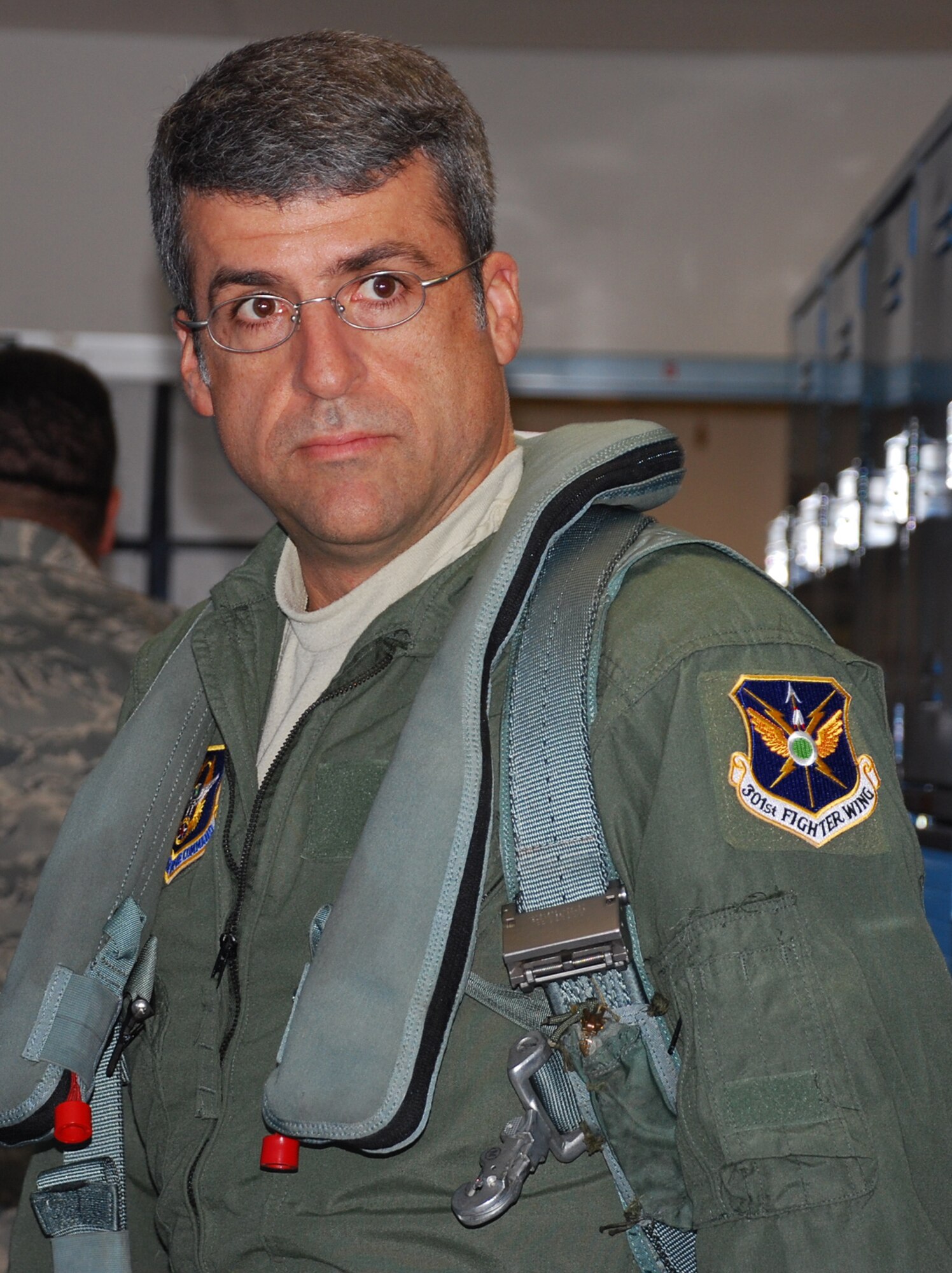 Maj. Daniel Dickey, 301st Maintenance Squadron commander, readies for his recent incentive ride in a 457th Fighter Squadron F-16 fighter jet. (U. S. Air Force Photo/Tech. Sgt. Julie Briden-Garcia)