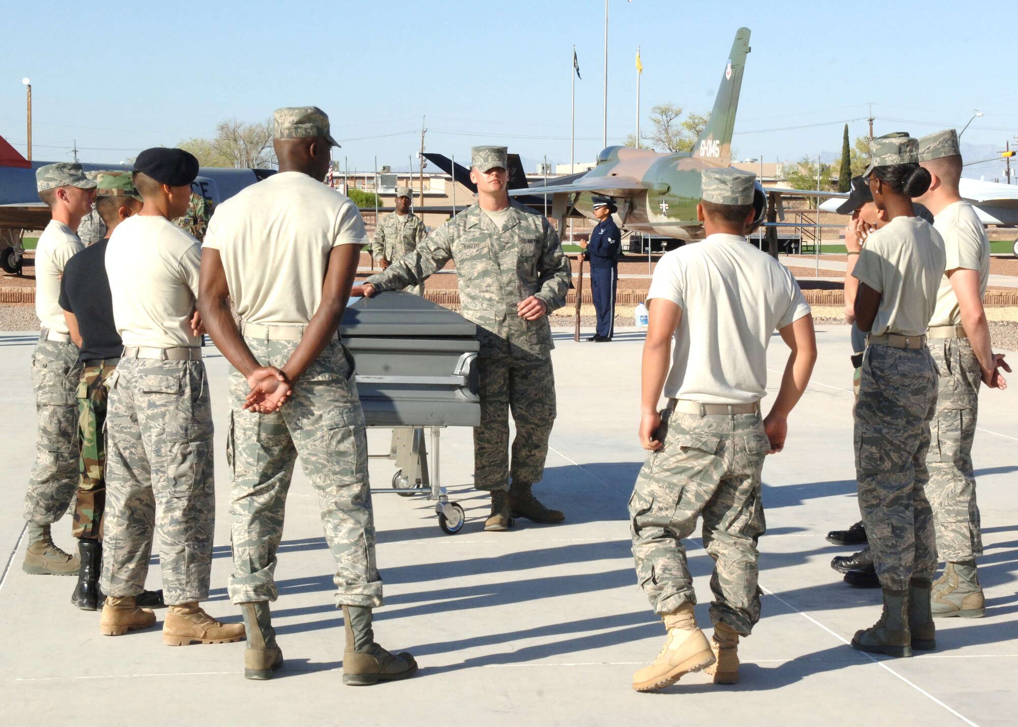 Staff Sergeant Alex Frizzo, an instructor with the Air Force Honor Guard, teaches members of the Holloman AFB Honor Guard proper techniques for body bearers March 17. The Air Force Honor Guard  periodically sends instructors to teach base honor guards proper procedures and instructions.  