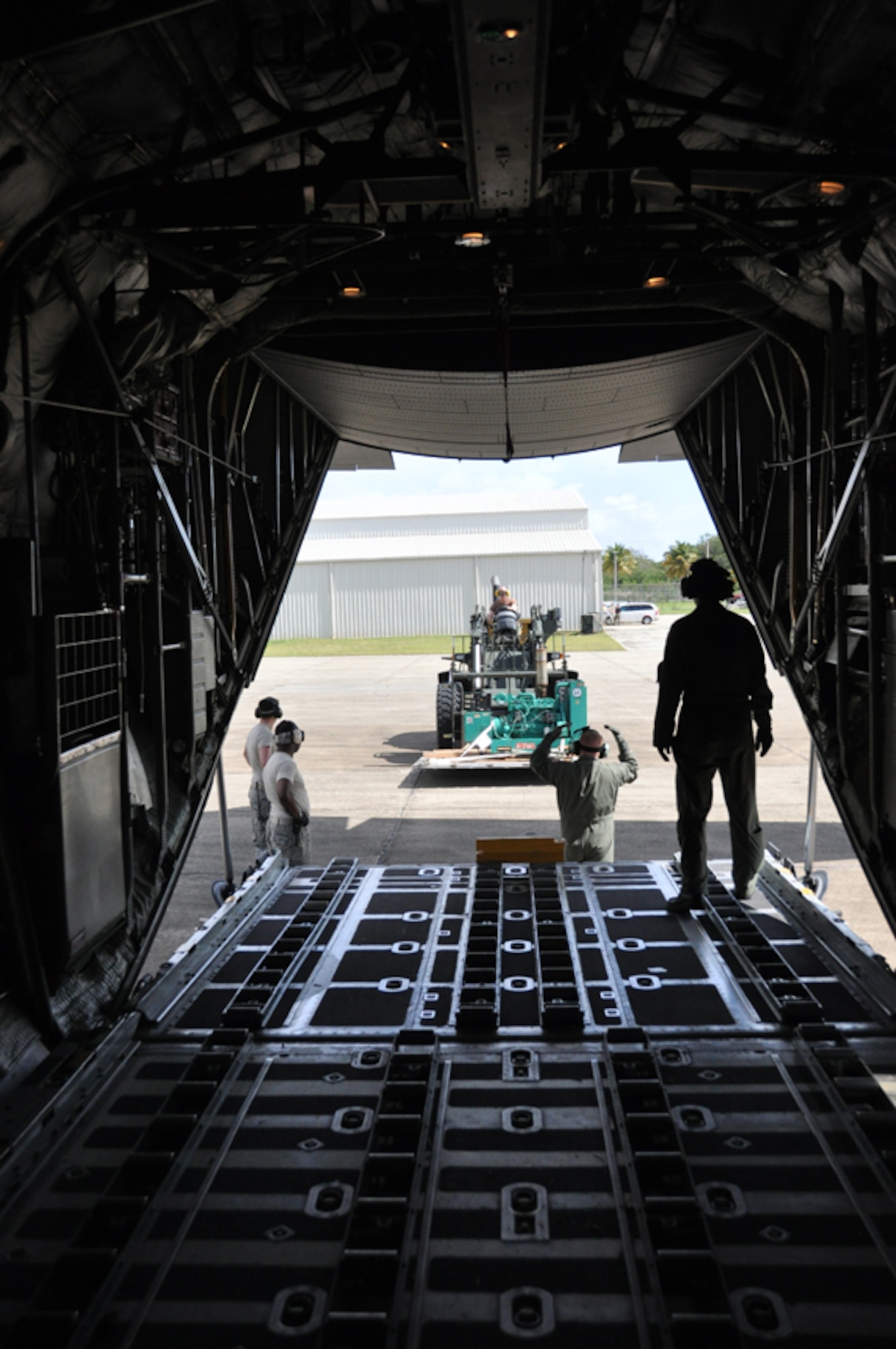 An Airman from the 817th Contingency Response Group uses a 10K forklift to load a generator onto a C-130 from the North Carolina Air National Guard during the Vigilant Guard exercise held in Puerto Rico, March 23-29. During the disaster relief exercise, Airmen from the 621st Contingency Response Wing conducted a hub-and-spoke operation that provided passenger and cargo movement to four locations around the island. (U.S. Air Force photo/1st Lt. Dustin Doyle)
