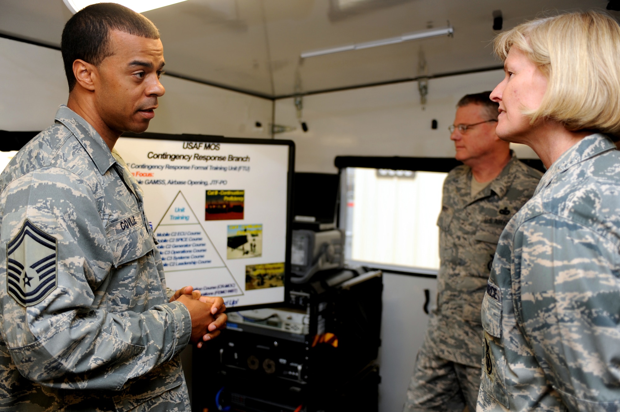 Senior Master Sgt. Troy Coville, Mobility Operations School, talks with Brig. Gen. Mary Kay Hertog, Air Force Director of Security Forces at the Pentagon, during General Hertog's visit to the U.S. Expeditionary Center on Fort Dix, N.J., on March 26, 2009.  General Hertog also gave a presentation for the Expeditionary Center's Professional Development Speaker Series observing the center's 15th anniversary.  The speaking engagement was also teleconferenced to 15 locations Air Force-wide to include Japan, Germany, Nevada, Texas, Illinois, Hawaii and California. (U.S. Air Force Photo/Staff Sgt. Nathan G. Bevier) 