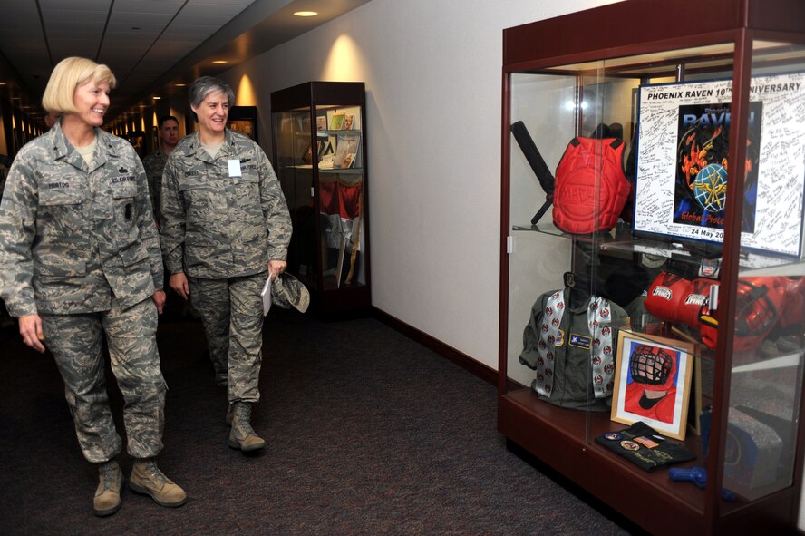 Brig. Gen. Mary Kay Hertog, Air Force Director of Security Forces at the Pentagon, and Col. Jennifer Pickett, Expeditionary Operations School commandant, look over the Phoenix Raven heritage case during General Hertog's visit to the U.S. Expeditionary Center on Fort Dix, N.J., on March 26, 2009.  General Hertog also gave a presentation for the Expeditionary Center's Professional Development Speaker Series observing the center's 15th anniversary.  The speaking engagement was also teleconferenced to 15 locations Air Force-wide to include Japan, Germany, Nevada, Texas, Illinois, Hawaii and California. (U.S. Air Force Photo/Staff Sgt. Nathan G. Bevier) 