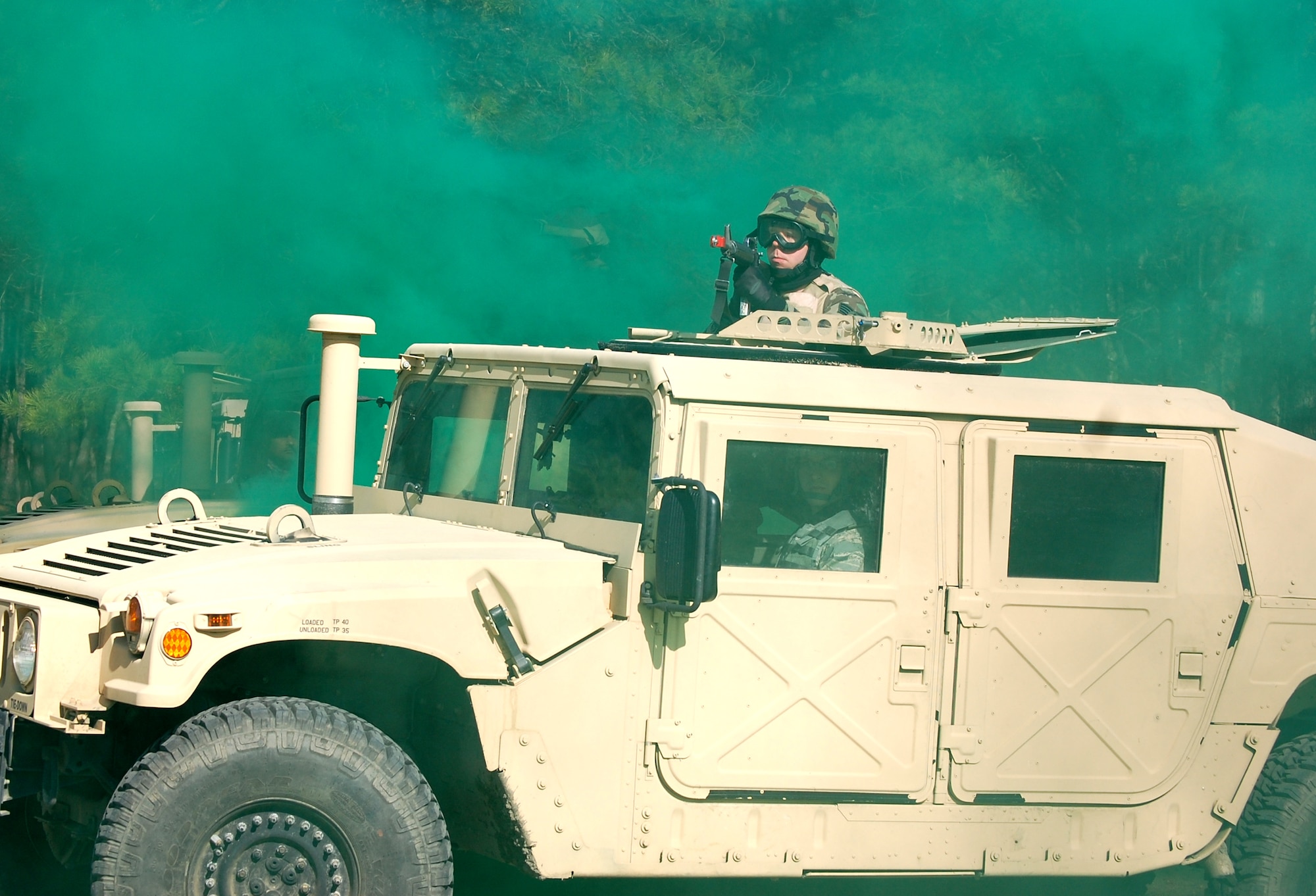 Students in the Advanced Contingency Skills Training Course participate in a scenario for convoy operations training on March 31, 2009, on a Fort Dix, N.J., range.  The course, taught by the U.S. Air Force Expeditionary Center's 421st Combat Training Squadron also on Fort Dix, prepares Airmen for upcoming deployments with advanced combat skills.  (U.S. Air Force Photo/Tech. Sgt. Scott T. Sturkol)