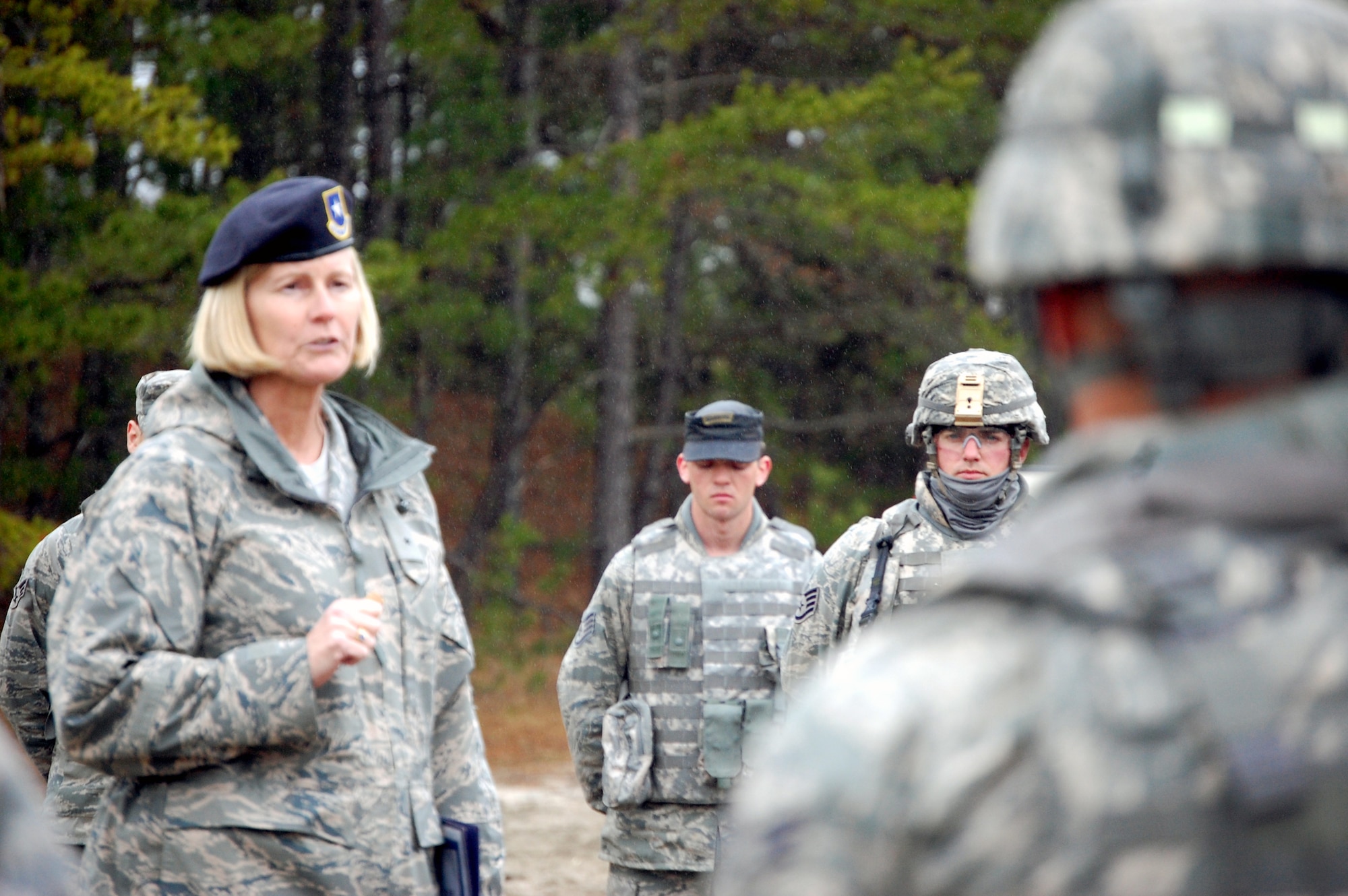 Brig. Gen. Mary Kay Hertog, the Air Force Director of Security Forces at the Pentagon in Arlington, Va., talks with security forces Airmen in training on a Fort Dix, N.J., range on March 26, 2009.  General Hertog was visiting with the students as part of a visit to the U.S. Air Force Expeditionary Center, also on Fort Dix.  General Hertog is the first female security forces officer to hold the top Air Forces security forces post and held a video-teleconferenced briefing to more than 15 locations world-wide as part of a professional speaker series at the Expeditionary Center.  (U.S. Air Force Photo/Tech. Sgt. Scott T. Sturkol)