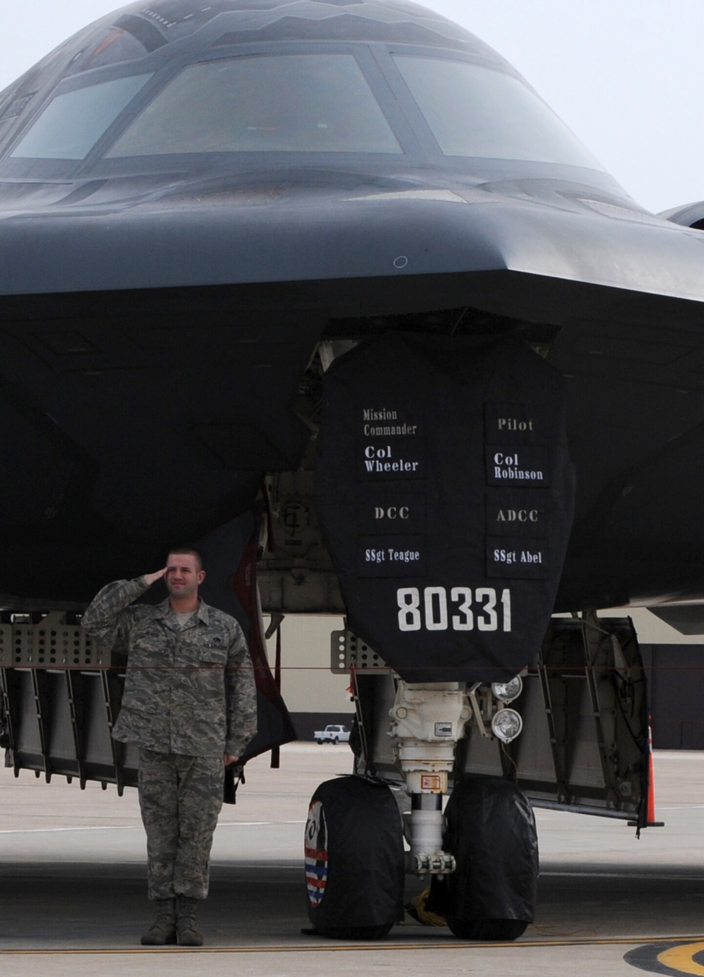 WHITEMAN AIR FORCE BASE, Mo. – Staff Sergeant Zachary Teague, 509th Aircraft Maintenance Squadron dedicated crew chief, salutes Col. Robert Wheeler, 509th Bomb Wing commander after changing the Mission Commander nameplate on a B-2 Spirit from Brig. Gen. Harencak to Colonel Wheeler March 26. (U.S. Air Force Photo by Airman 1st Class Carlin Leslie)