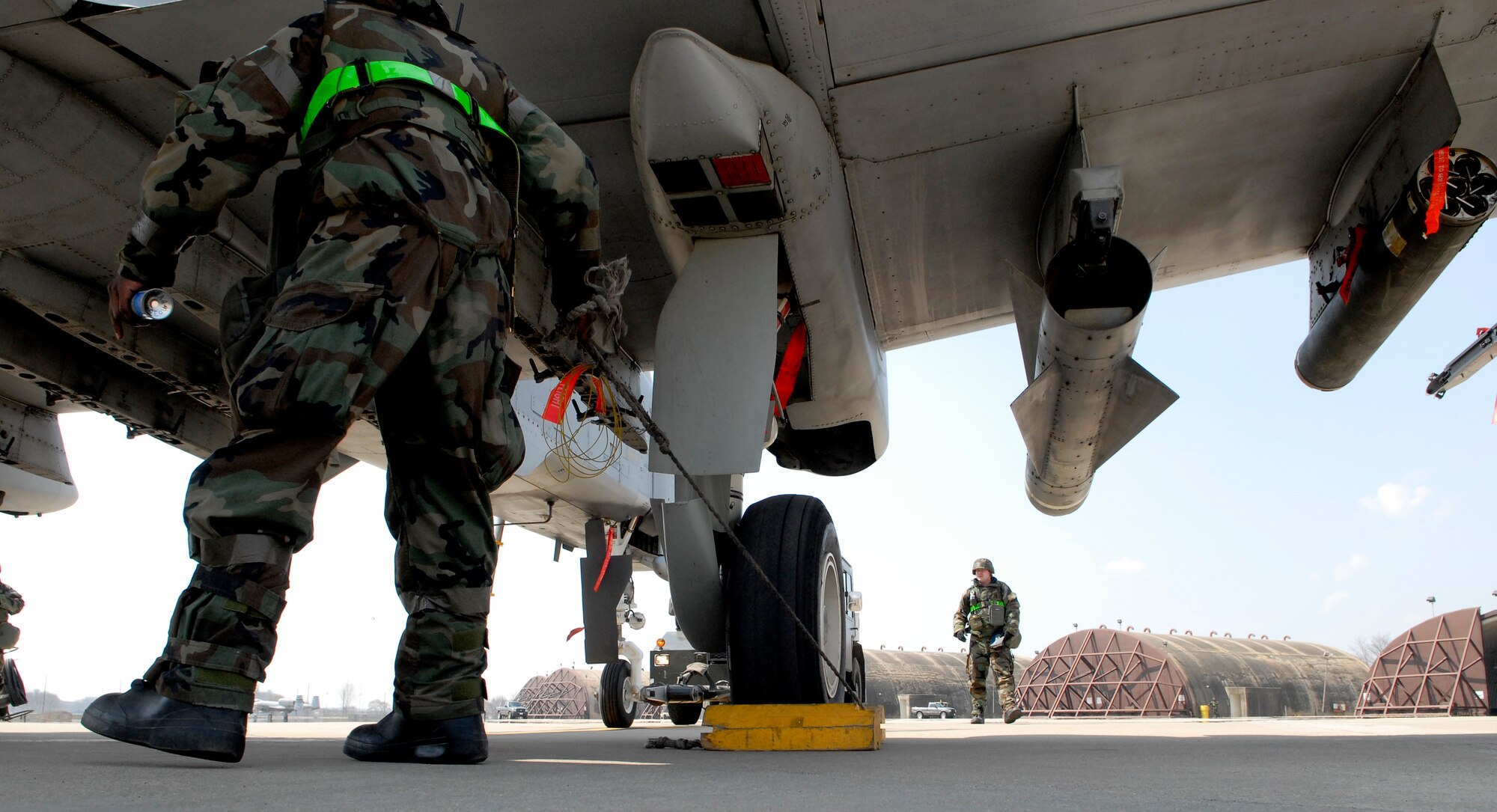 Airmen from the 25th Aircraft Maintenance Unit pull the wheel chocks on an A-10 Thunderbolt II at Osan Air Base, Republic of Korea, during Operations Readiness Exercise Beverly Bulldog 09-02, March 31. The pre-scheduled exercise is designed to help the 51st Fighter Wing prepare for their Operational Readiness Inspection in April. (U.S. Air Force photo/Staff Sgt. Brian Ferguson)