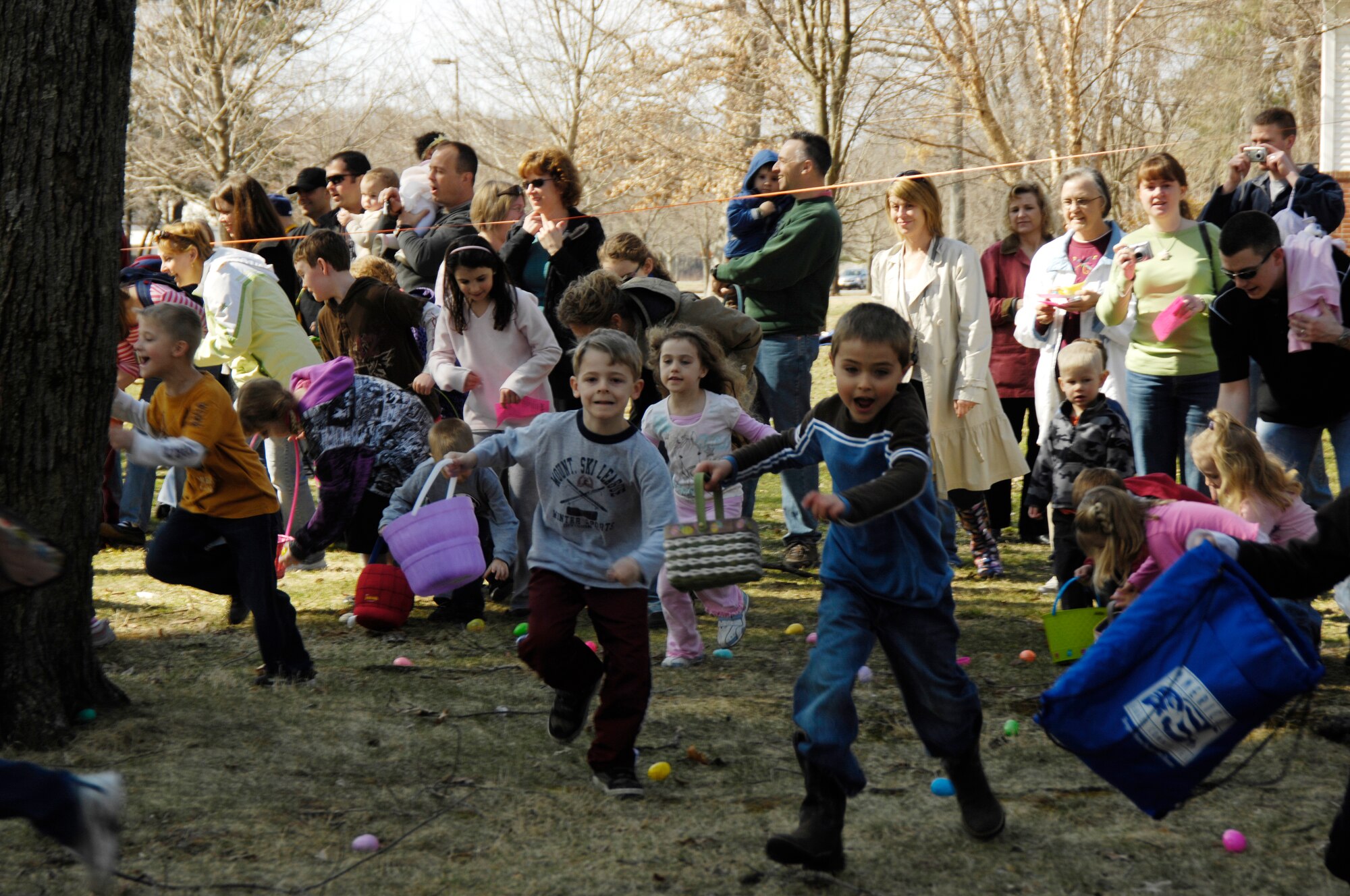 HANSCOM AIR FORCE BASE, Mass. –Hanscom children rush to gather eggs during the Spring Fling event, March 28 at the Base Chapel. The event was sponsored by the Hanscom Spouses Club and Base Chapel and included a number of family activities such as crafts, games, face painting and a visit from the Easter Bunny. (U.S. Air Force photo by Linda LaBonte Britt)
