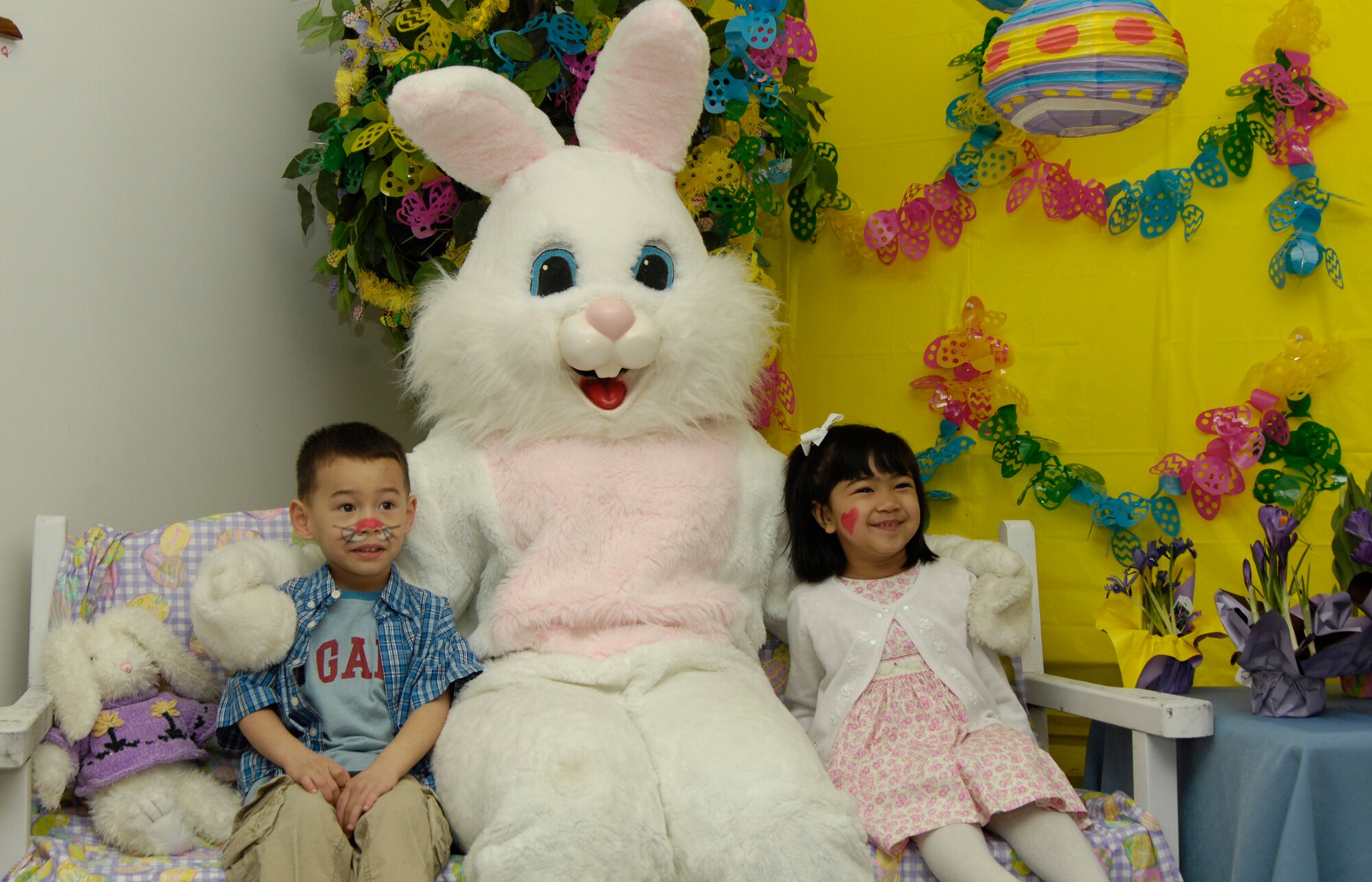 HANSCOM AIR FORCE BASE, Mass. –Max and Mia Woolums have their picture taken with the Easter Bunny at the Spring Fling event on March 28 at the Base Chapel.  The event was sponsored by the Hanscom Spouses Club and Base Chapel and included a number of activities such as crafts, games, face painting and a visit from the Easter Bunny. (U.S. Air Force photo by Linda LaBonte Britt) 