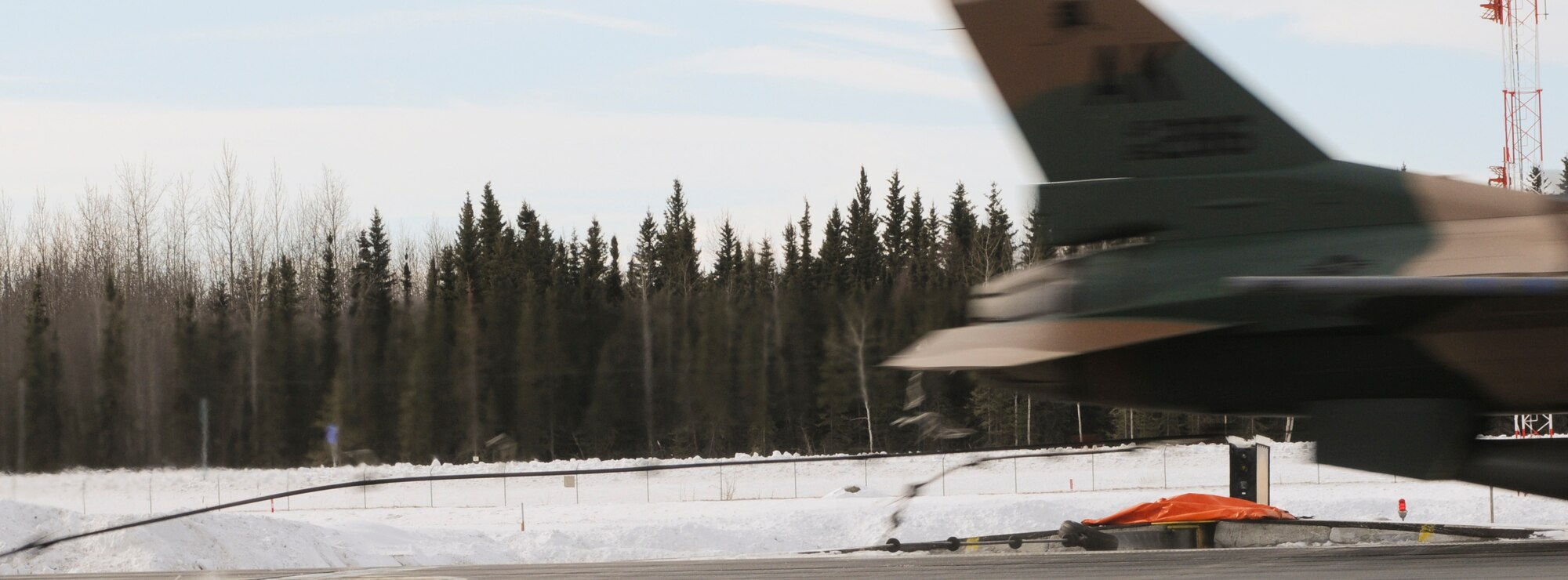 An F-16 Fighting Falcon 18th Aggressor Squadron engages the aircraft arresting cable at a speed of 124 knots to test the emergency breaking system March 25, 2009, Eielson Air Force Base, Alaska. The barrier is certified annually to ensure proper functioning in the event a jet will need to use the barrier for emergency breaking when landing. (U.S. Air Force photo/Airman 1st Class Laura Max)