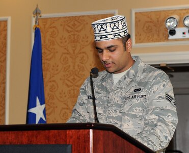 LANGLEY AIR FORCE BASE, Va. -- Senior Airman Shaqeel Kamal, Muslim Lay Leader reads the Koran during this year's National Prayer Breakfast here March 31. The National Prayer Breakfast provides an opportunity for Airmen to reaffirm the moral and spiritual values upon which our nation was founded. (U.S. Air Force photo/Airman 1st Class Gul Crockett)