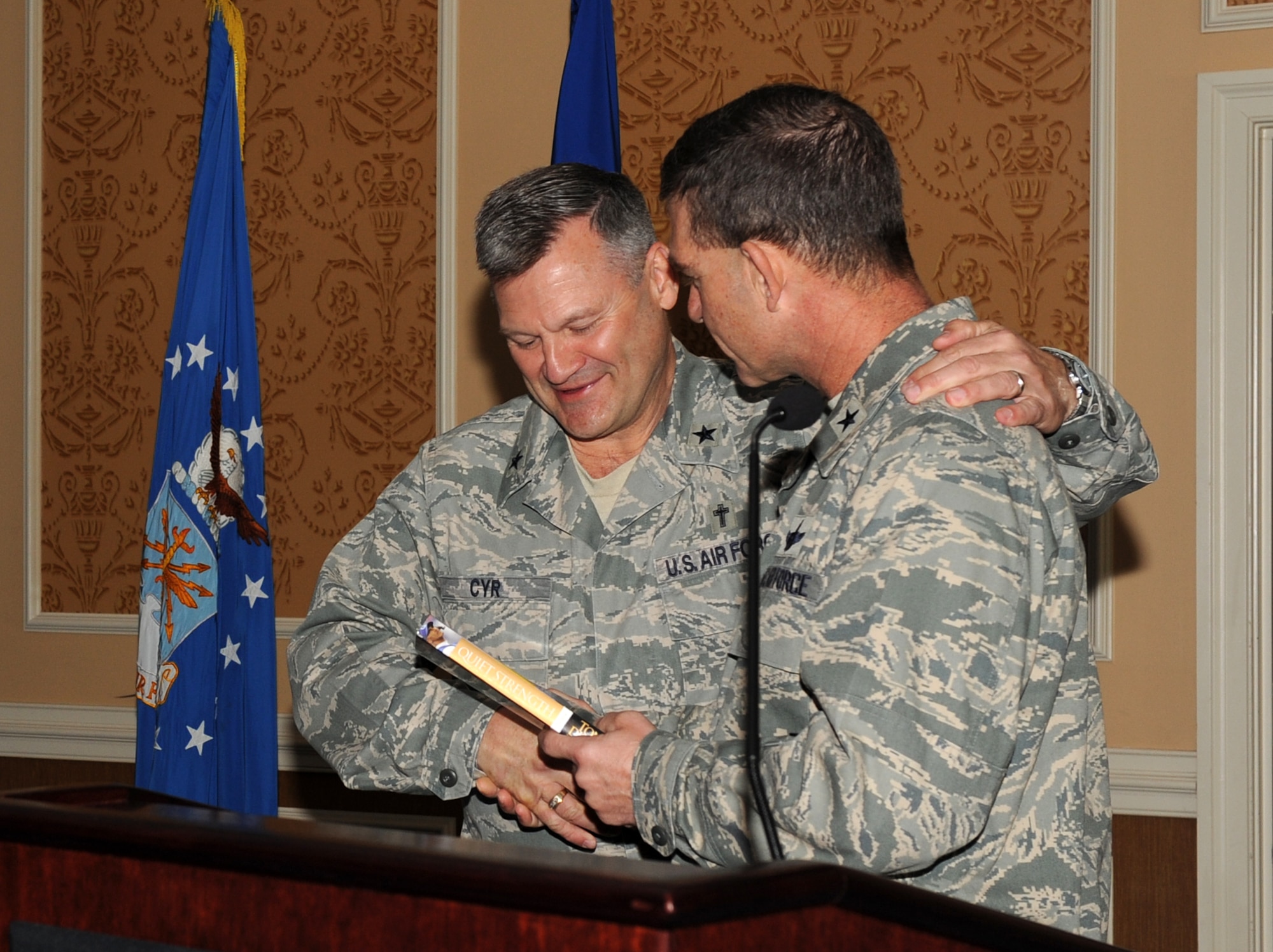LANGLEY AIR FORCE BASE, Va. -- Brig. Gen. Mark A. Barrett, 1st Fighter Wing commander, presented Tony Dungy's book "Quiet Strength" to Chaplain (Brig. Gen.) David H. Cyr, Air Force Deputy Chief of Chaplains, March 31. The National Prayer Breakfast provides an opportunity for Airmen to reaffirm the moral and spiritual values upon which our nation was founded. (U.S. Air Force photo/Airman 1st Class Gul Crockett)