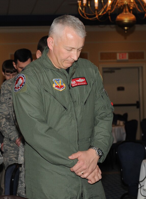 LANGLEY AIR FORCE BASE, Va. - Col. Mark A. McCauley, 192nd Fighter Wing commander, prays during this year's National Prayer Breakfast March 31. The National Prayer Breakfast provides an opportunity for Airmen to reaffirm the moral and spiritual values upon which our nation was founded. (U.S. Air Force photo/Airman 1st Class Gul Crockett)