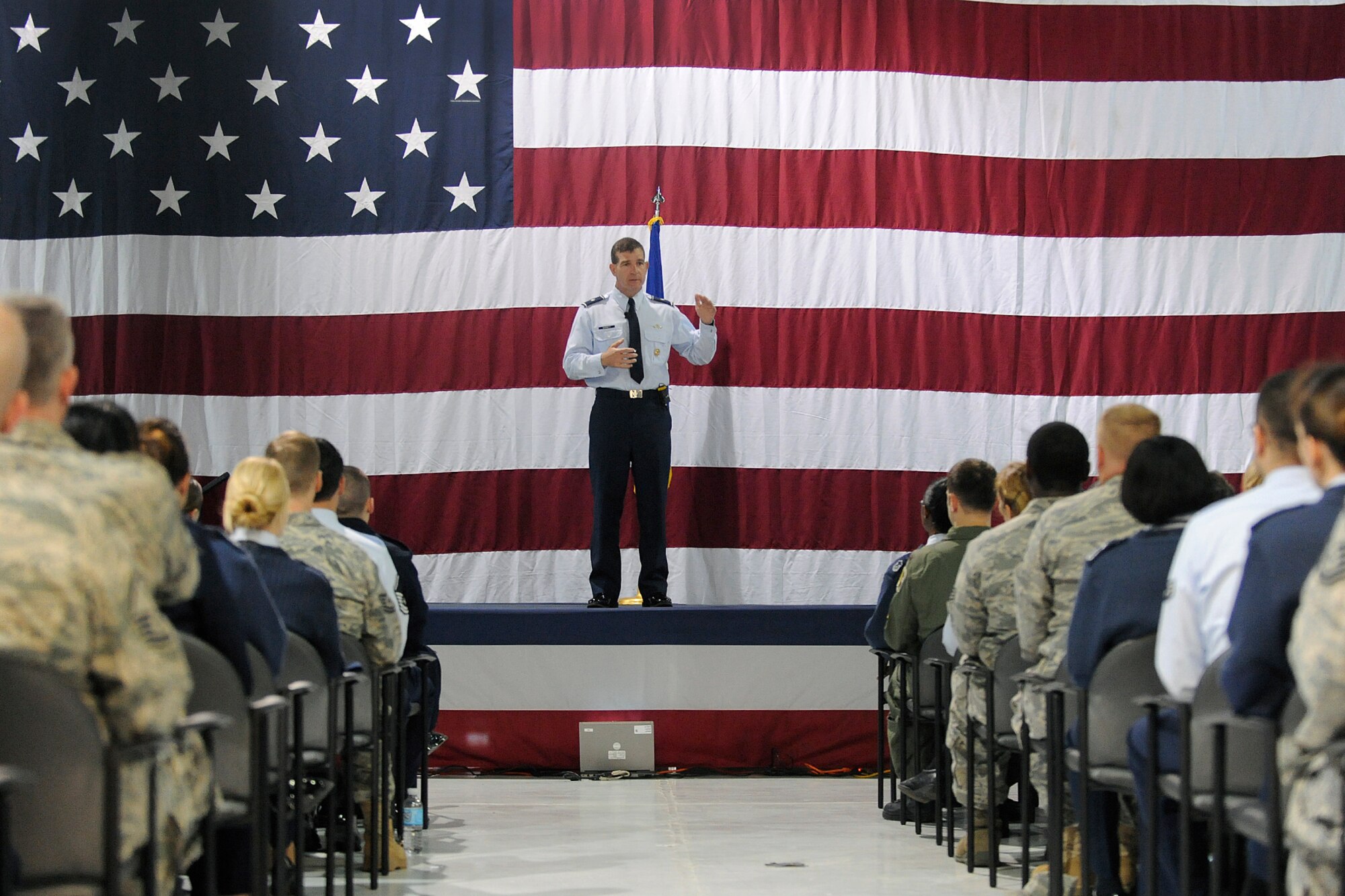 LANGLEY AIR FORCE BASE, Va. -- Brig. Gen. Mark A. Barrett, 1st Fighter Wing commander, speaks to Airmen during a commander's call here March 30.  General Barrett, recognized outstanding achievements of Airmen, spoke of the upcoming Operational Readiness Inspection, and  answered questions about joint basing, safety, and family support from wing members in attendance.  (U.S. Air Force photo/Senior Airman Vernon Young)