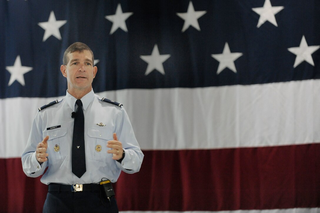 LANGLEY AIR FORCE BASE, Va. -- Brig. Gen. Mark A. Barrett, 1st Fighter Wing commander, speaks to Airmen during a commander's call here March 30.  General Barrett, recognized outstanding achievements of Airmen, spoke of the upcoming Operational Readiness Inspection, and  answered questions about joint basing, safety, and family support from wing members in attendance.  (U.S. Air Force photo/Senior Airman Vernon Young)
