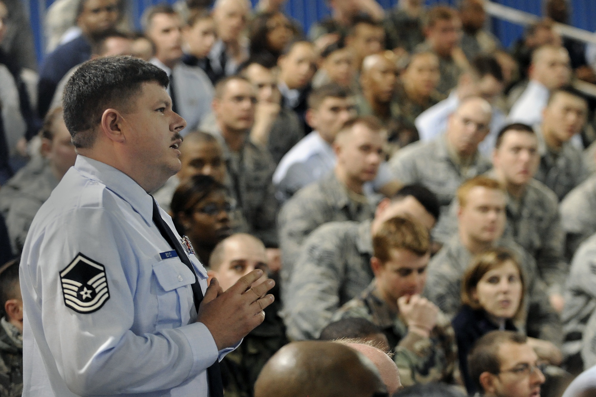 LANGLEY AIR FORCE BASE, Va. --  Master Sgt. Thomas Boyd, 1st Medical Group, asks Brig. Gen. Mark A. Barrett, 1st Fighter Wing commander, about motorcycle safety at commander's call here March 30.  General Barrett recognized outstanding achievements of Airmen, spoke of the upcoming Operational Readiness Inspection, and  answered questions about joint basing, safety, and family support from wing members in attendance.  (U.S. Air Force photo/Senior Airman Vernon Young)