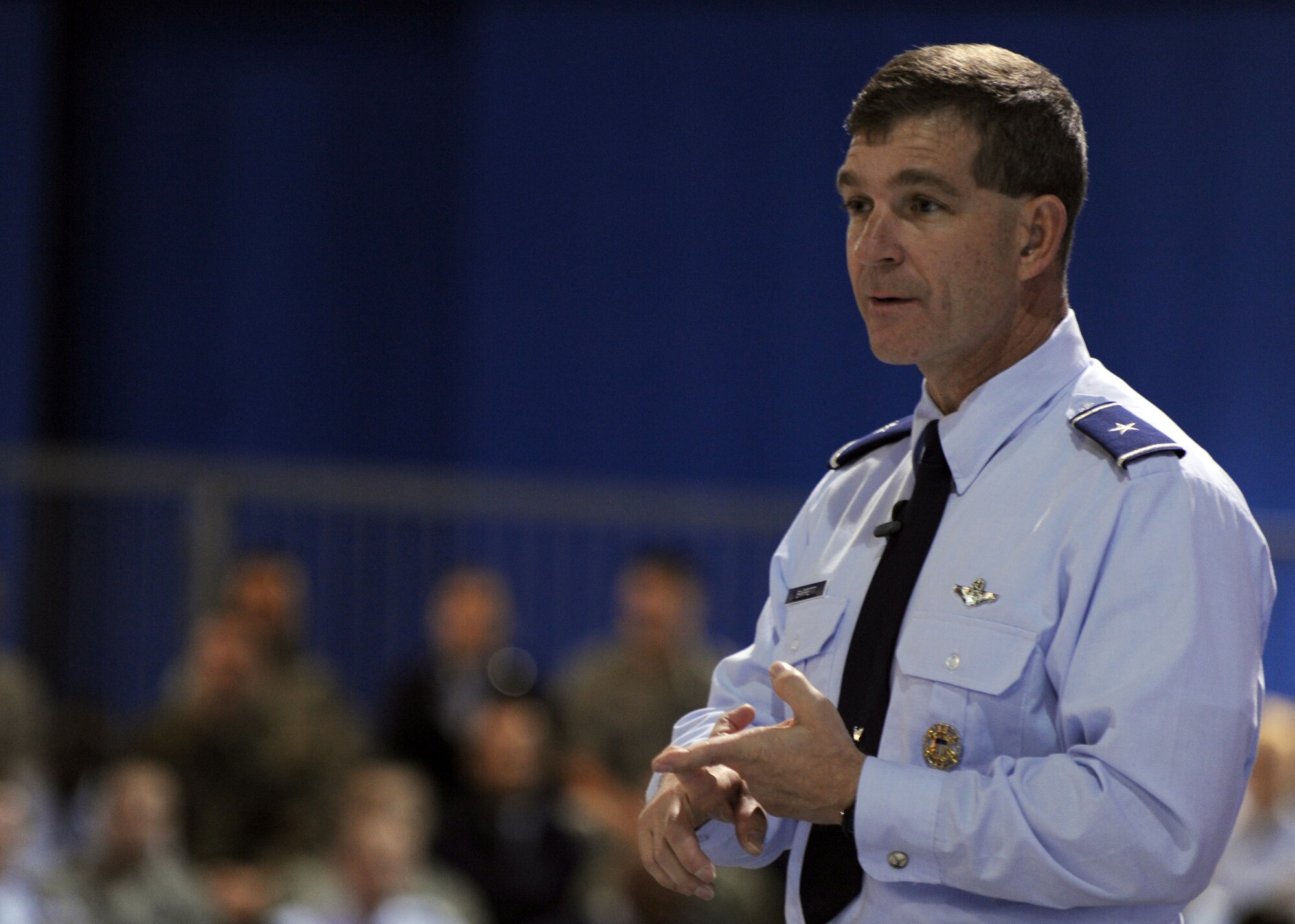 LANGLEY AIR FORCE BASE, Va. -- Brig. Gen. Mark A. Barrett, 1st Fighter Wing commander, speaks to Airmen during a commander's call here March 30.  General Barrett, recognized outstanding achievements of Airmen, spoke of the upcoming Operational Readiness Inspection, and  answered questions about joint basing, safety, and family support from wing members in attendance.  (U.S. Air Force photo/Airman 1st Class Jonathan Koob)