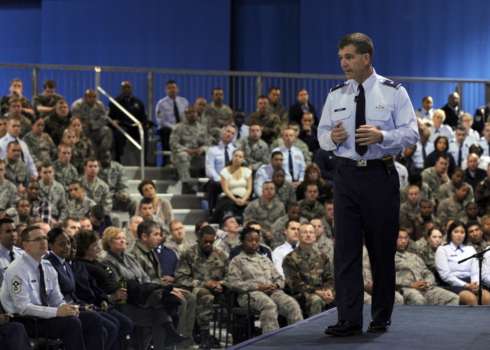 LANGLEY AIR FORCE BASE, Va. -- Brig. Gen. Mark A. Barrett, 1st Fighter Wing commander, speaks to Airmen during a commander's call here March 30.  General Barrett, recognized outstanding achievements of Airmen, spoke of the upcoming Operational Readiness Inspection, and  answered questions about joint basing, safety, and family support from wing members in attendance.  (U.S. Air Force photo/Airman 1st Class Jonathan Koob)