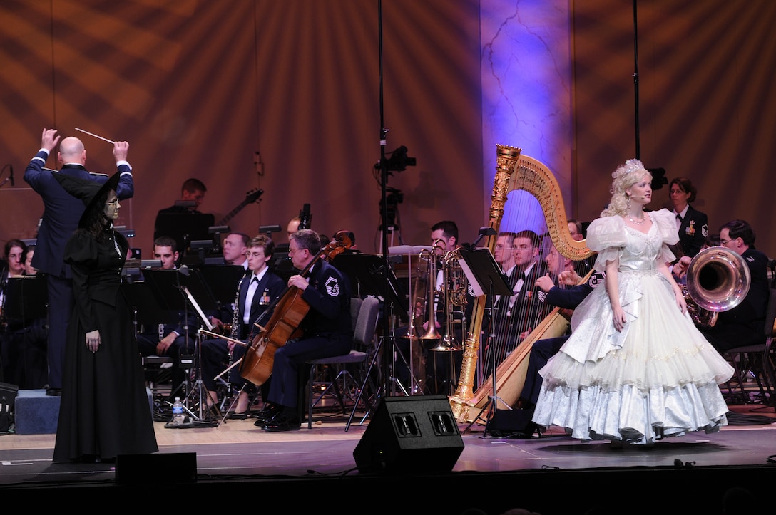 Tech. Sgt. Emily Lewis and Senior Master Sgt. Angela Burns sing the roles of the Bad Witch and the Good Witch from the Broadway production <em>Wicked</em> portion of <em>Journeys Through Oz.</em> (U.S. Air Force photo by Staff Sgt. Dan DeCook)