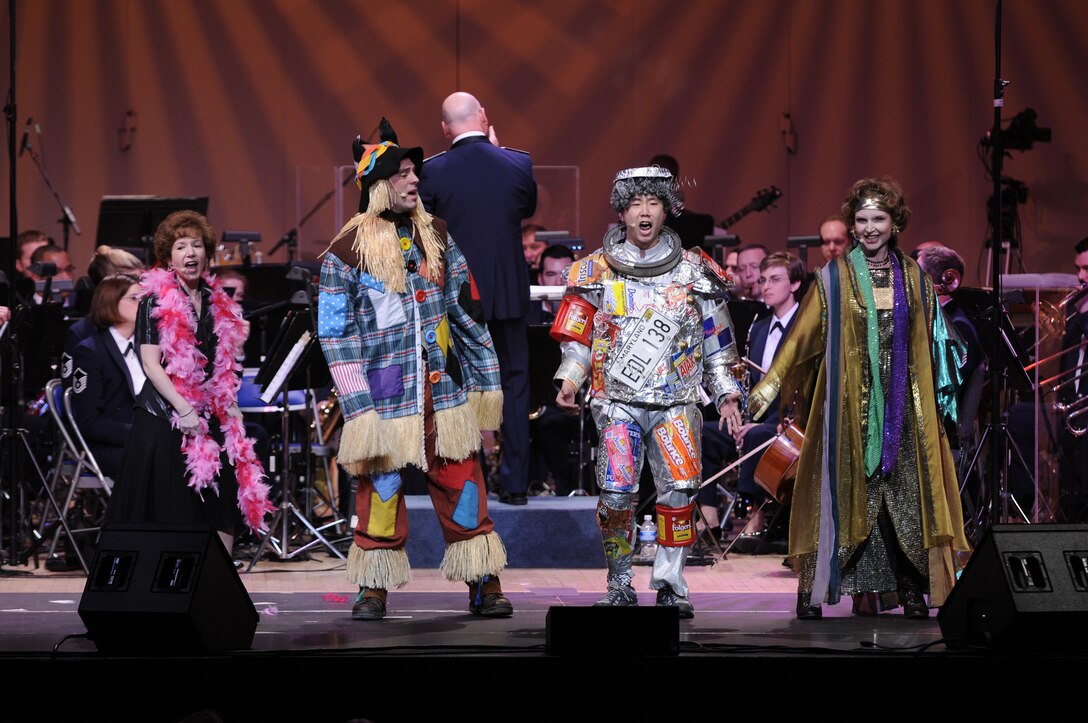 Master Sgt. Linda Waring, Master Sgt. Eric Sullivan, Tech. Sgt. Benjamin Park, and Master Sgt. Anne Seaton in roles from <em>The Wiz</em>, another integral part of <em>Journeys Through Oz.</em> (U.S. Air Force photo by Staff Sgt. Dan DeCook)