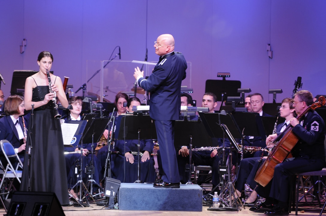 Katherine Kohler, the winner of the 2009 Colonel George S. Howard Young Artist Competition, also performed on the February 22 GAS concert.   She is shown here playing Carl Maria von Weber's <em>Concertino for Clarinet</em> with The United States Air Force Band, conducted by Colonel Dennis M. Layendecker, the Commander and Music Director of the Band. (U.S. Air Force photo by Staff Sgt. Dan DeCook)