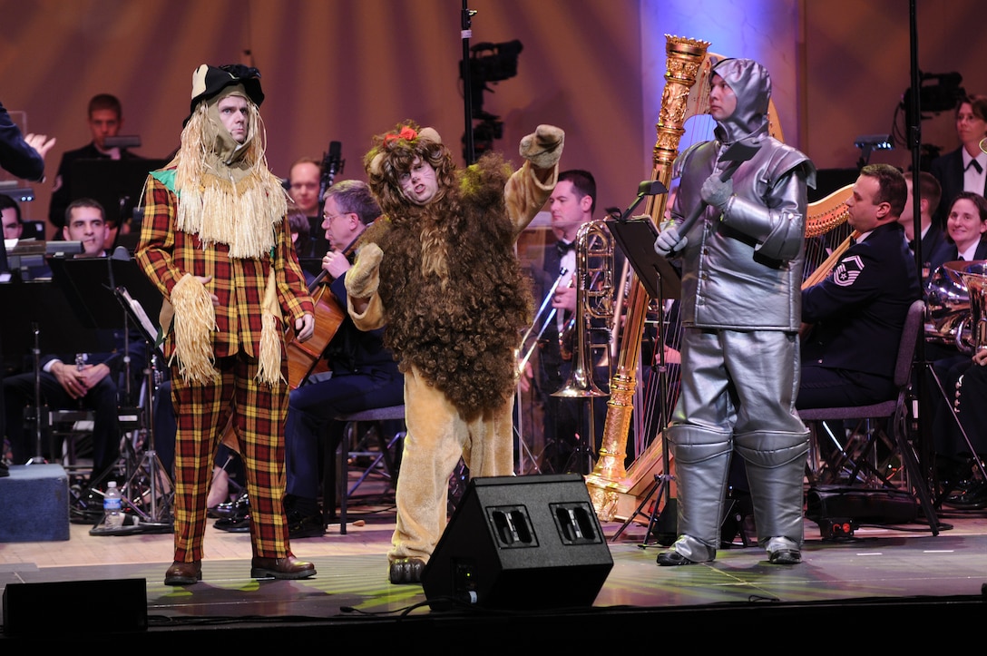 Master Sgt. Eric Sullivan, Tech. Sgt. Matthew Smith, and Master Sgt. Bradley Bennett portray the Scarecrow, the Lion and Tin Man from <em>Journeys Through Oz: Three Stories from the Emerald City</em>, an original medley arranged by Tech. Sgt Tadd Russo for the Concert Band and Singing Sergeants.  The medley contains music from <em>The Wizard of Oz</em>, <em>The Wiz</em> and <em>Wicked.</em> (U.S. Air Force photo by Staff Sgt. Dan DeCook)