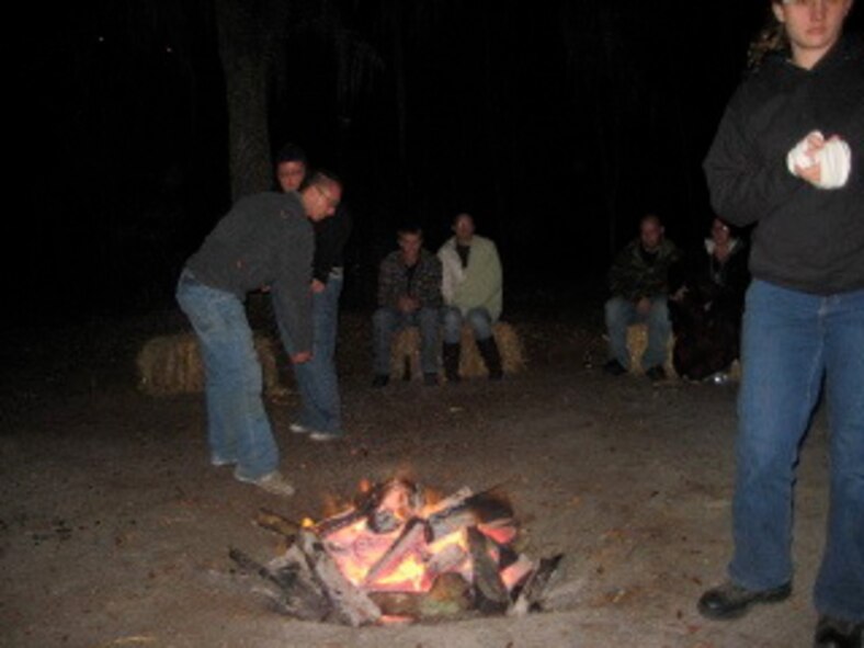 MOODY AIR FORCE BASE, Ga. -- Couples gather around a campfire to discuss the final day's events of the marriage retreat held at the Hannan Ranch in Valdosta, Ga,  March 21. (Courtesy photo)