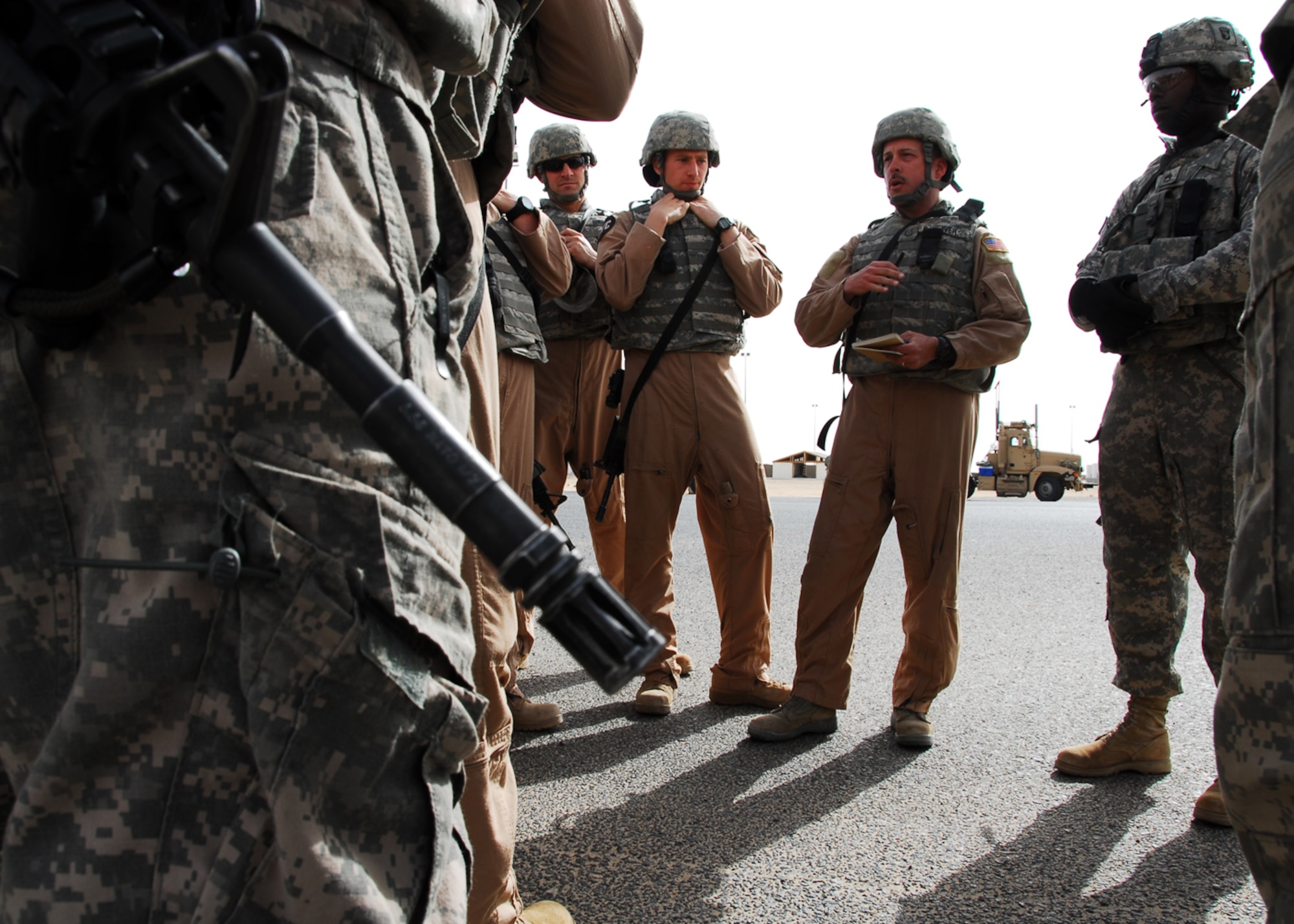 SOUTHWEST ASIA -- Tech. Sgt. John Weaver, 586th Expeditionary Logistics Readiness Squadron convoy commander, provides the final mission brief to all of the line haul truckers and Soldiers providing convoy security at Khabari Crossing, March 26. The mission brief entails a safety briefing, equipment check, weather briefing and a security briefing given by the Army security commander. Sergeant Weaver is currently deployed from Hulburt Field, Fla. and is originally from Jay, Fla. (U.S. Air Force photo/ Senior Airman Courtney Richardson)