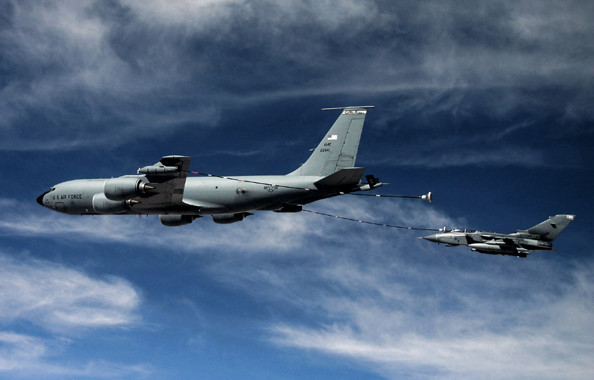 A KC-135 Stratotanker refuels a Royal Air Force GR-4 Tornado over Iraq using the multi-point refueling systems. With MPRS, Air Force tankers have the versatility to refuel Air Force, Navy and coalition aircraft all in the same mission. (U.S. Air Force file photo)