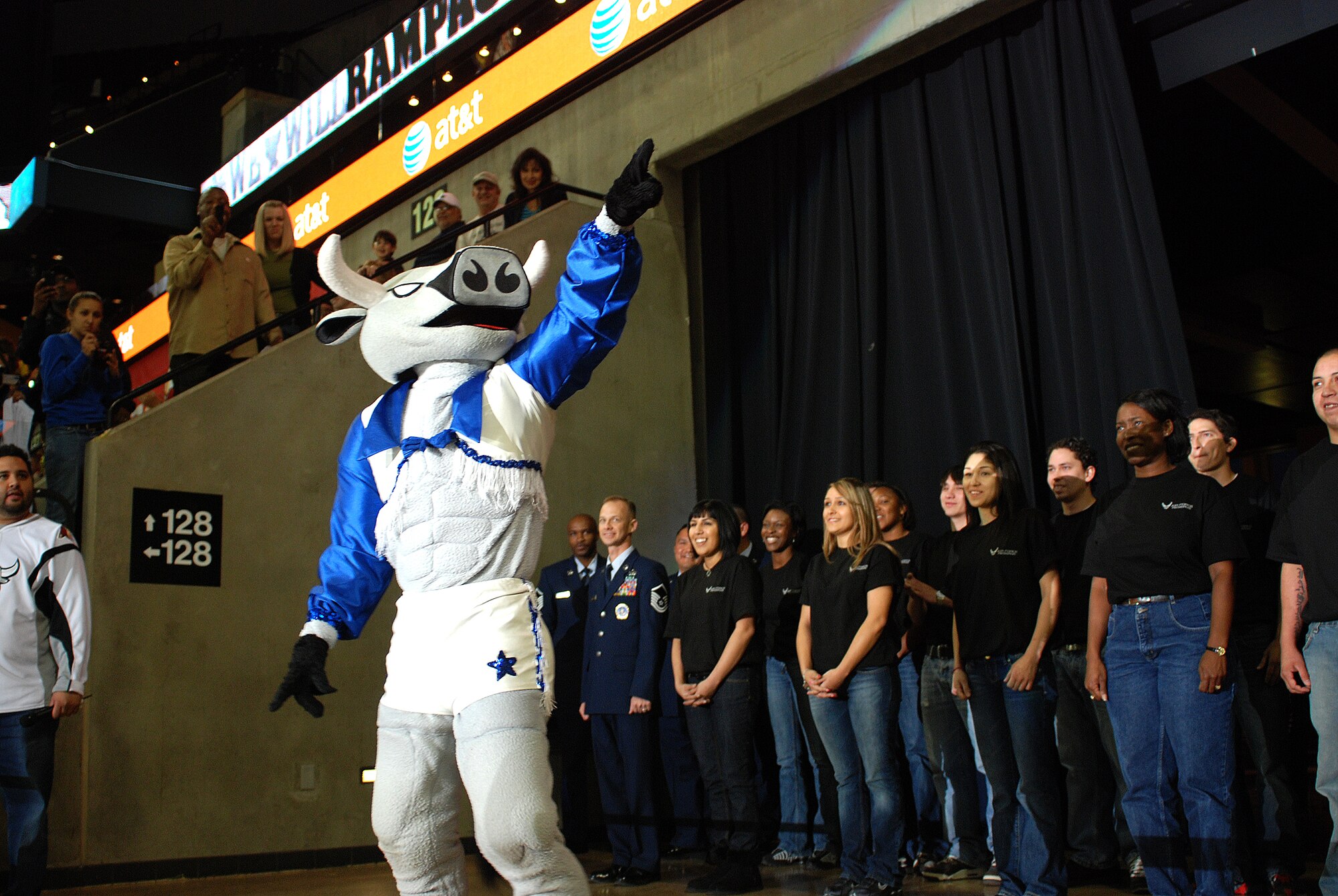 Future Alamo Wing reservists enlist during a mass enlistment ceremony held between the first and second periods of a San Antonio Rampage hockey game. The new members of the U.S. Air Force Reserve were welcomed by cheers and applause from the fans nearly filling the stadium. Brig. Gen. John C. Fobian, 433rd Airlift Wing commander, conducted the ceremony and, followed by members of the 433rd Recruiting Squadron, was the first to welcome the Alamo Wing's 15 newest members. The new Recruits will begin Air Force Basic Military Training at various times in the next few months. (U.S. Air Force Photo/Airman Brian McGloin)