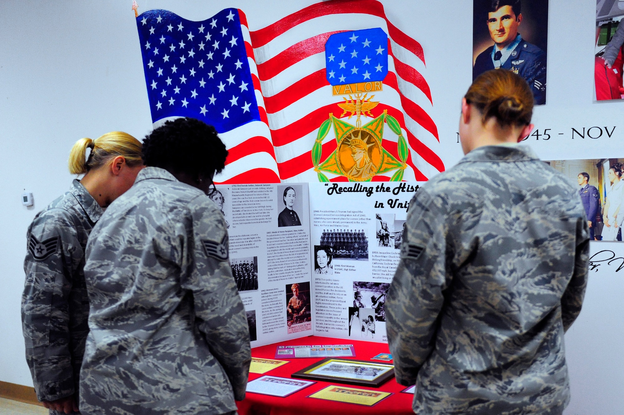 Posters of females in the U.S. military were placed throughout the room during the 380th Air Expeditionary Wing Women's History Month symposium luncheon March 28 at an air base in Southwest Asia. The theme, "Recalling Women in Uniform" highlighted the contributions of female Airmen and Soldiers both past and present. (U.S. Air Force photo/Capt. Jennifer Pearson) 

