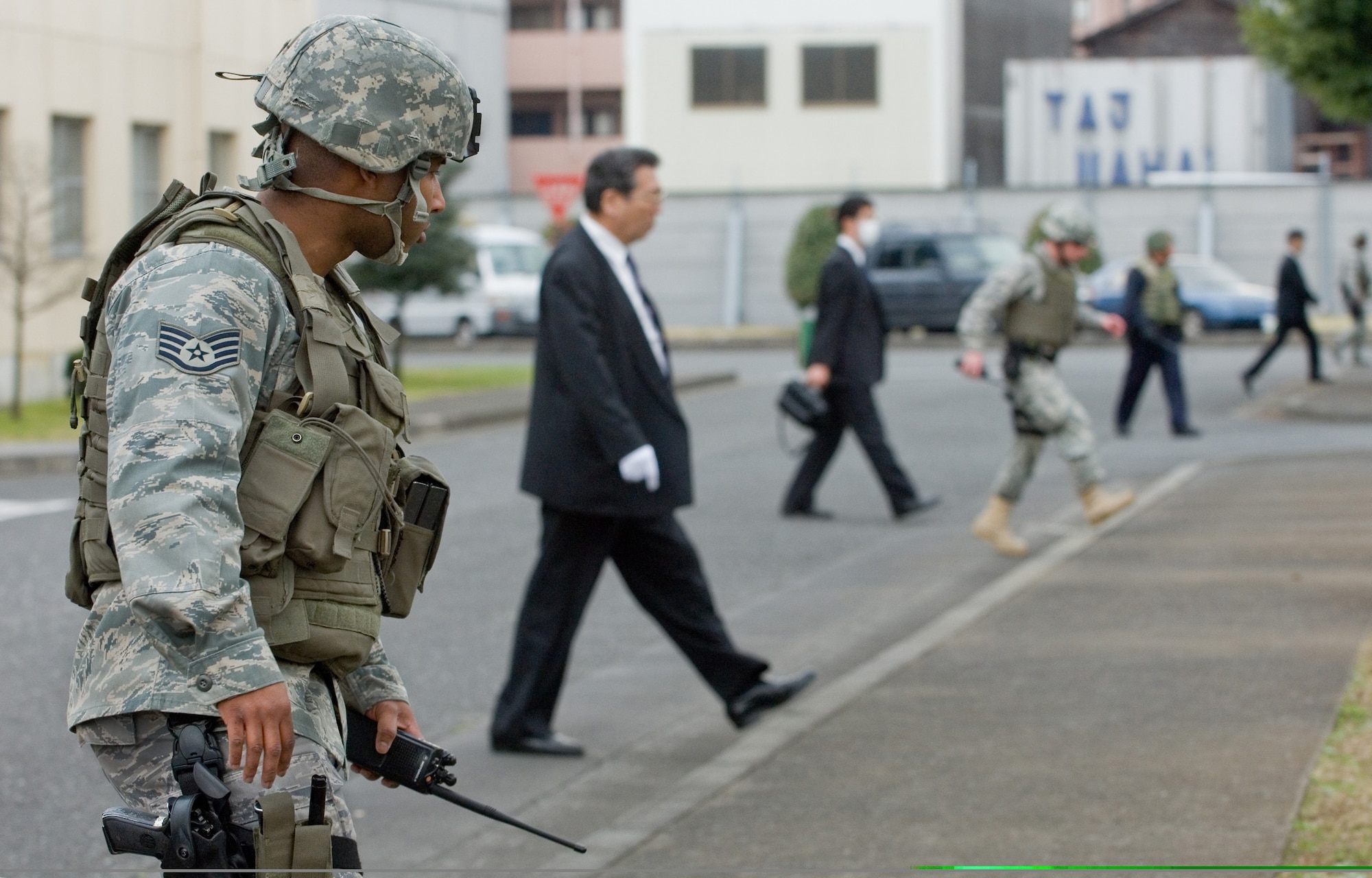 Staff Sgt. Jay King searches for unexploded ordnance with the Japanese National Police-Fussa Division during a joint unexploded ordnance response exercise March 27 at Yokota Air Base, Japan. Sergeant King is assigned to the 374th Security Force Squadron. (U.S. Air Force photo/Osakabe Yasuo) 
