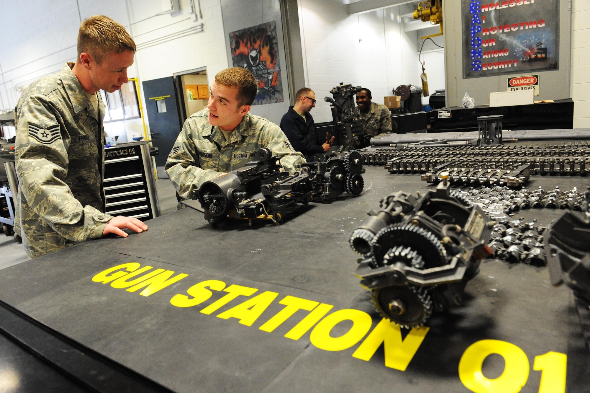 SHAW AIR FORCE BASE, S.C. -- Staff Sgt. Brandon Ferrel and Senior Airman Zach Johnson, 20th Equipment Maintenance Squadron armament system specialists, rebuild the M61A1 20mm gatling gun on new gun station table created with a rapid improvement event held by the 20th EMS March 12, 2009. The RIE is part of Air Force Smart Operations of the 21st Century being implemented on Shaw AFB. (U.S. Air Force photo/Senior Airman Matthew Davis)