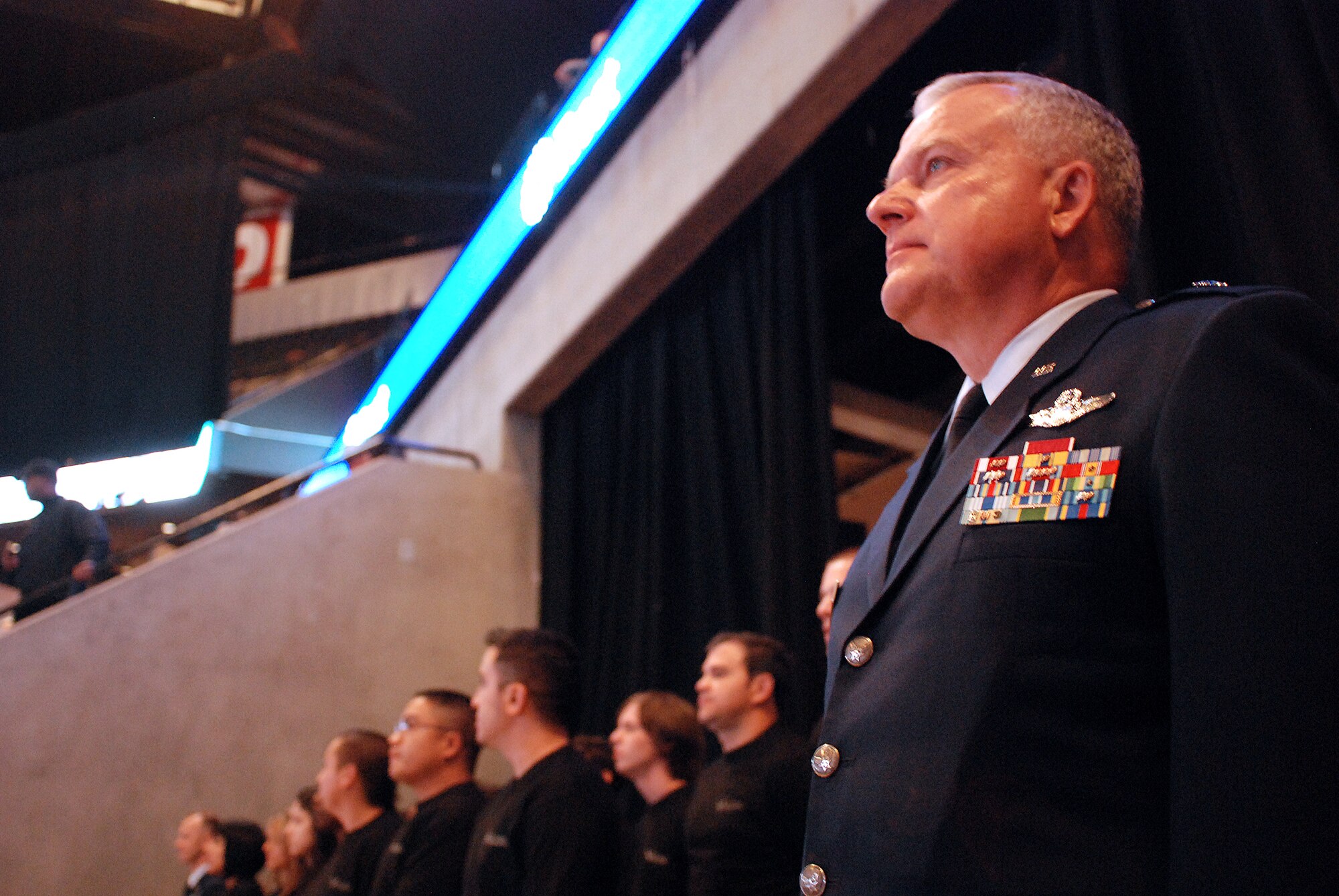 Future Alamo Wing reservists enlist during a mass enlistment ceremony held between the first and second periods of a San Antonio Rampage hockey game. The new members of the U.S. Air Force Reserve were welcomed by cheers and applause from the fans nearly filling the stadium. Brig. Gen. John C. Fobian, 433rd Airlift Wing commander, conducted the ceremony and, followed by members of the 433rd Recruiting Squadron, was the first to welcome the Alamo Wing's 15 newest members. The new Recruits will begin Air Force Basic Military Training at various times in the next few months. (U.S. Air Force Photo/Airman Brian McGloin)