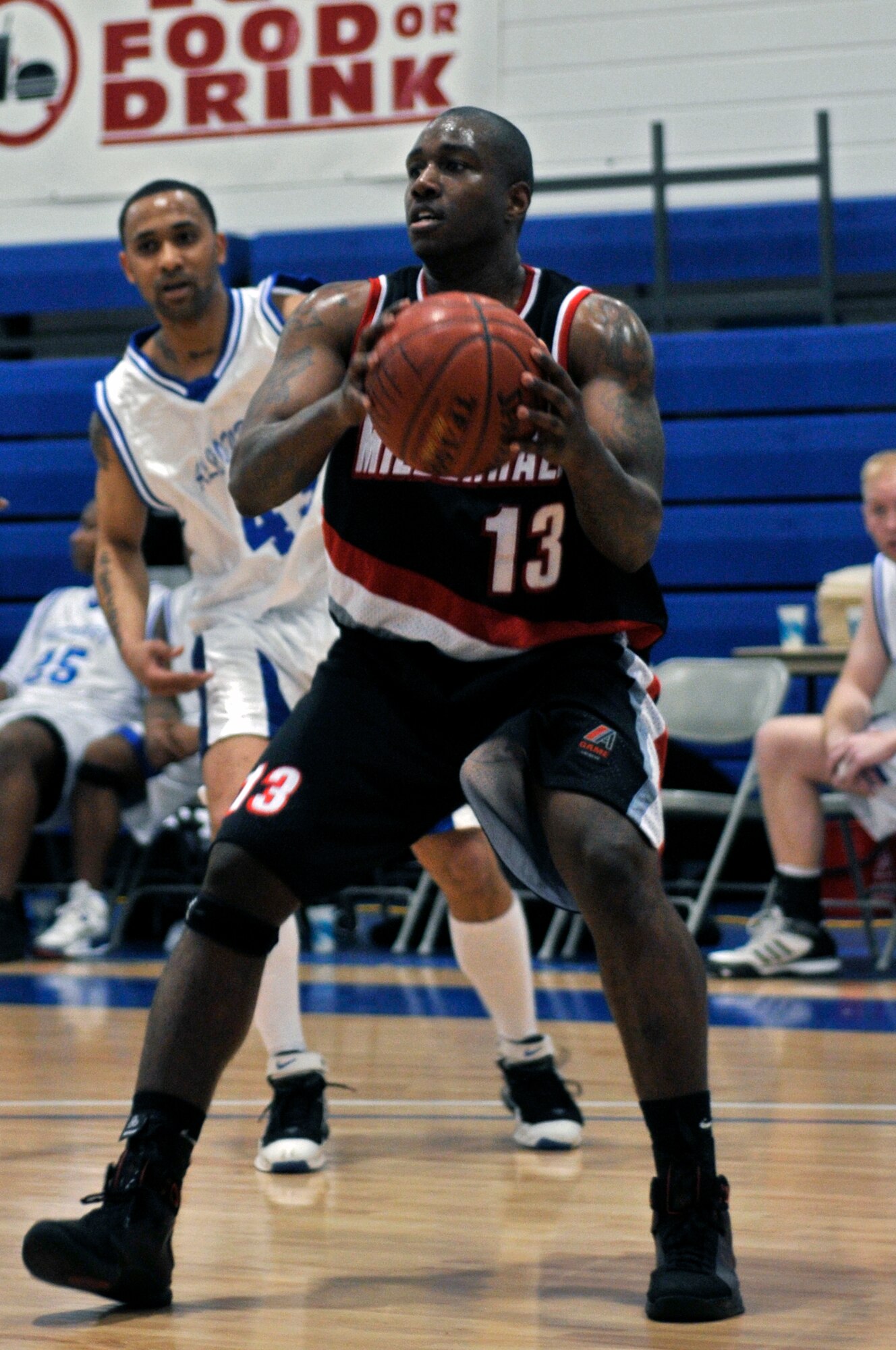 Glen Thomas, a RAF Mildenhall guard looks for a open team mate March 26, 2009 at RAF Lakenheath, England. Teams from six bases in USAFE participated in the championships. (U.S. Air Force photo by Airman 1st Class Perry Aston)