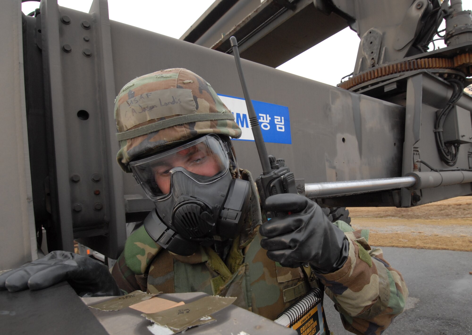 Senior Airman Jason Landis 8th Maintenance Squadron, reports M-8 paper comndition to his Unit Control Center while performing Post Attack Reconnaissance checks at Kunsan Air Base, Republic of Korea, March 31, 2009. Kunsan Airmen are currently participating in the peninsula-wide Operational Readiness Exercise Beverly Bulldog 09-02 in preparation for an upcoming Operational Readiness Inspection. (U.S. Air Force Photo by Master Sgt. John M. Foster)