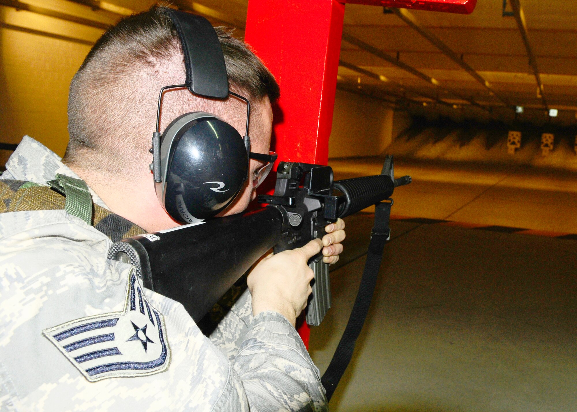 SPANGDAHLEM AIR BASE, Germany – Staff Sgt. Troy Dontigney, 606th Air Control Squadron, aligns his sites before taking a shot at the base range, March 23, 2009. All Airmen must qualify with either an M-16 or M-9 prior to deploying. (U.S. Air Force photo by Airman 1st Class Nicholas Wilson)