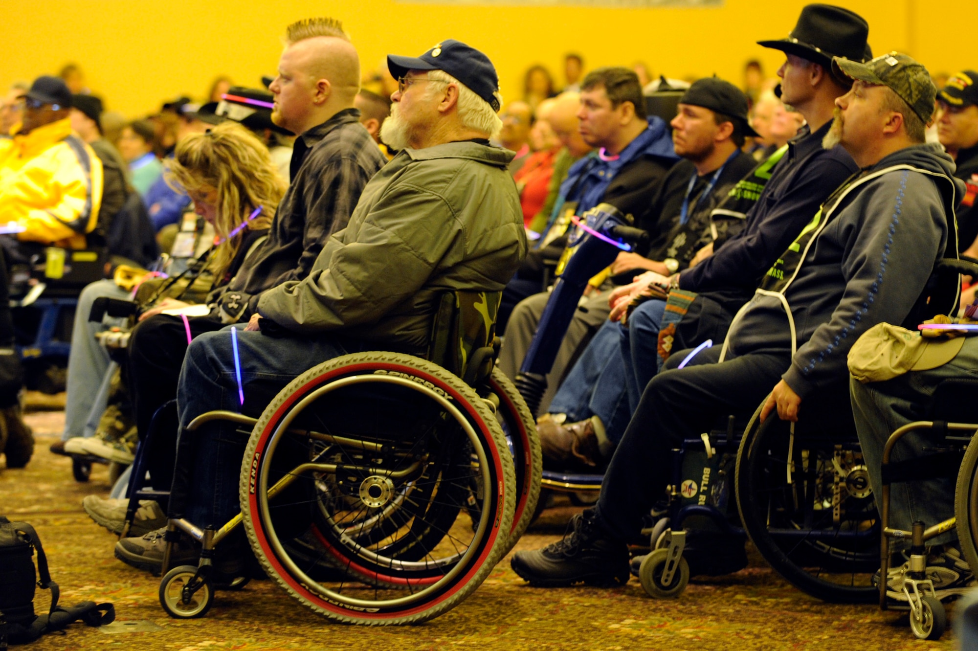 Veterans attend the opening ceremony inside The Silver Tree Hotel March 29 for the 23rd National Disabled American Veterans Winter Sports Clinic in Snowmass Village, Colo. The event is sponsored by the Department of Veterans Affairs and Disabled American Veterans. (U.S. Air Force photo/Staff Sgt. Desiree N. Palacios)