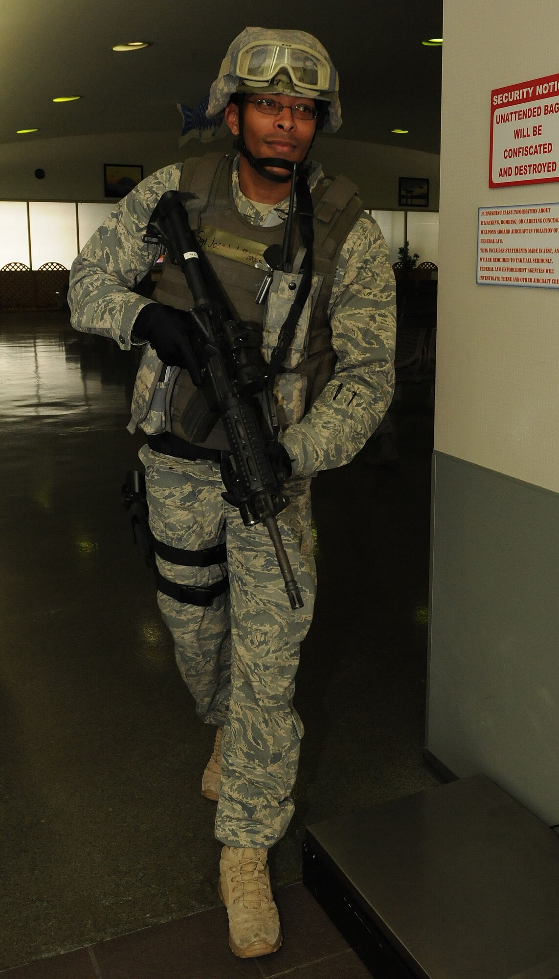 YOKOTA AIR BASE, Japan --  Staff Sgt. Joseph Blake, 374th Security Forces Squadron, secures the area around the PAX terminal March 31 during Phase I of Exercise Beverly Morning 09-03. Yokota is conducting an exercise March 30 through April 3 to maintain operational readiness.  (U.S. Air Force photo/Airman 1st Class Michael Dillon)