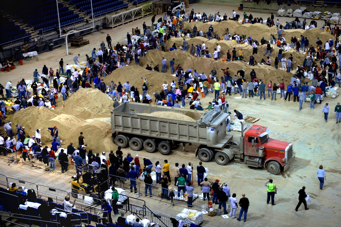Volunteers fill sandbags at the Fargodome in Fargo, N.D., March 29, 2009, to stop the Red River's rising waters along the North Dakota-Minnesota border. More than 2,400 National Guard troops also are responding to the area's flooding.