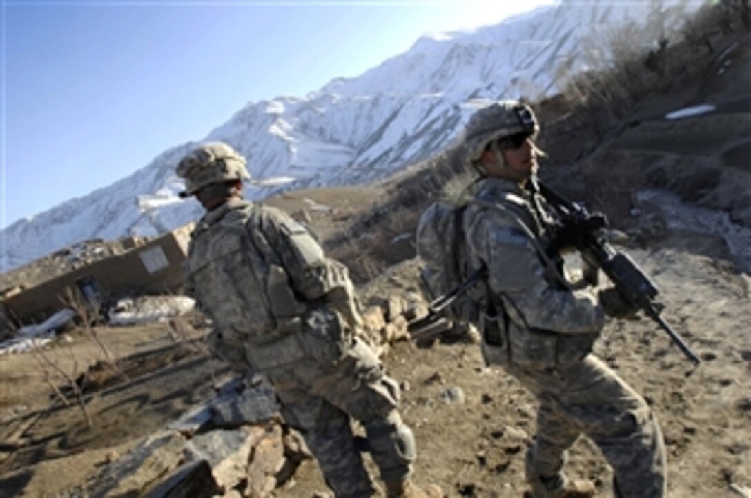 U.S. Army Staff Sgt. Robert Rios, right, and Pfc. Michael Halter lead a patrol down a mountain during a village assessment in Jalrez Valley, Wardak province, Afghanistan, March 12, 2009. The soldiers are assigned to Company A, 2nd Battalion, 87th Infantry Regiment.